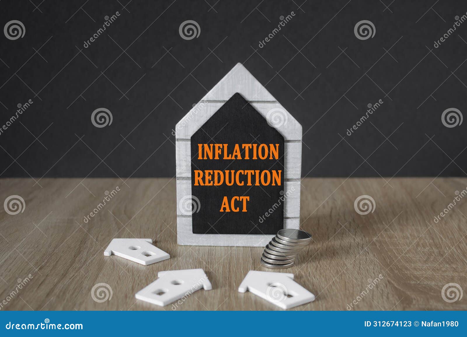 ira inflation reduction act . concept words inflation reduction act on a black board in the  of a house near miniature