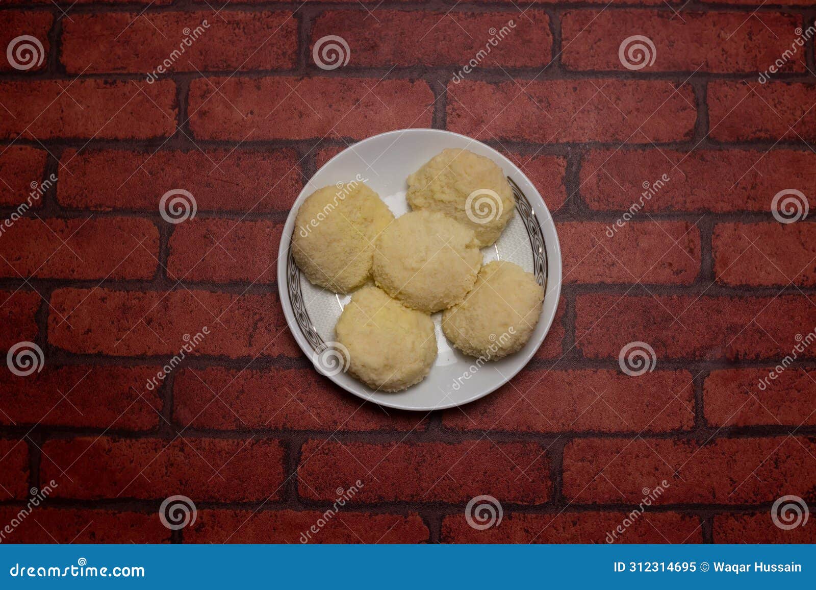 irani bhog sweet served in plate  on background top view of bangladeshi dessert food