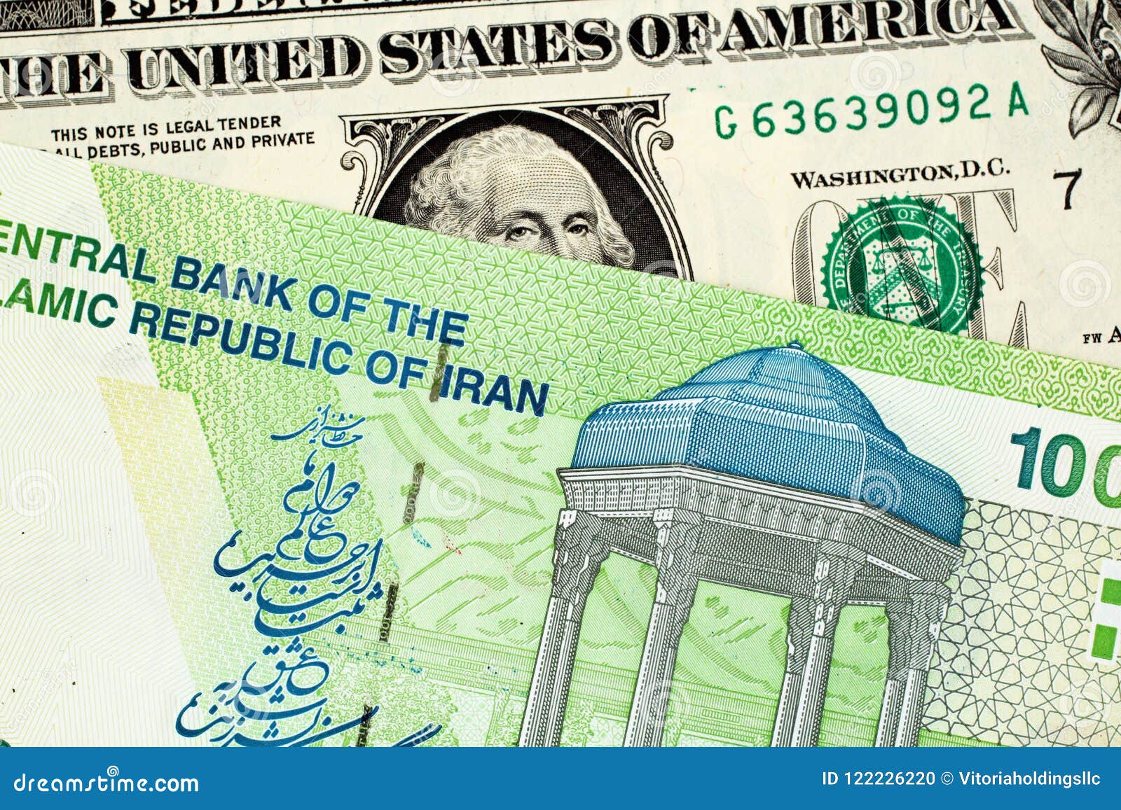 Iranian 10000 Rial Note with American One Dollar Bill Stock Photo