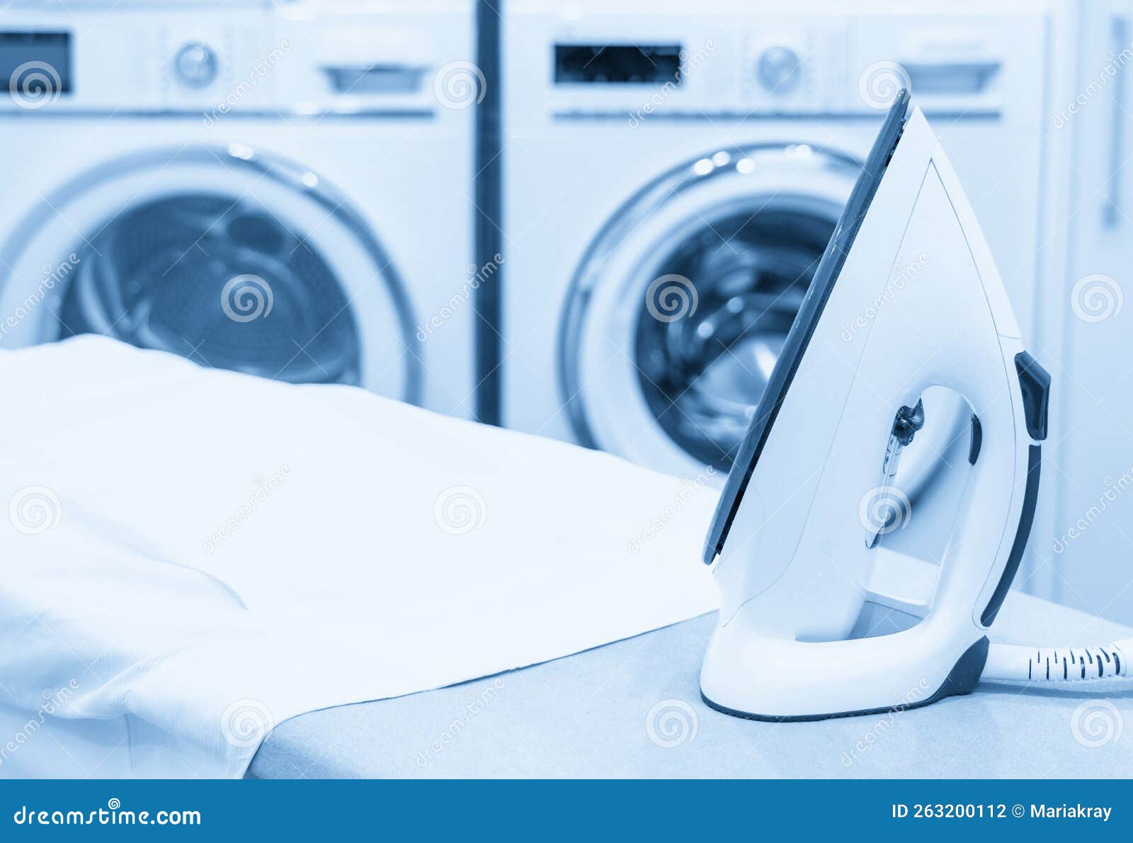 Iron on Ironing Board with White Shirt in Laundry Room Stock Photo Image of electric