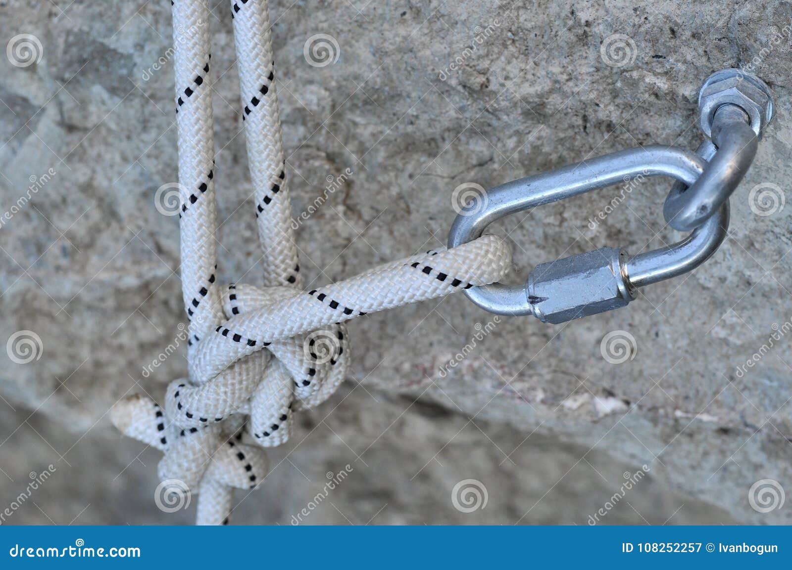 iron piton in a granite rock