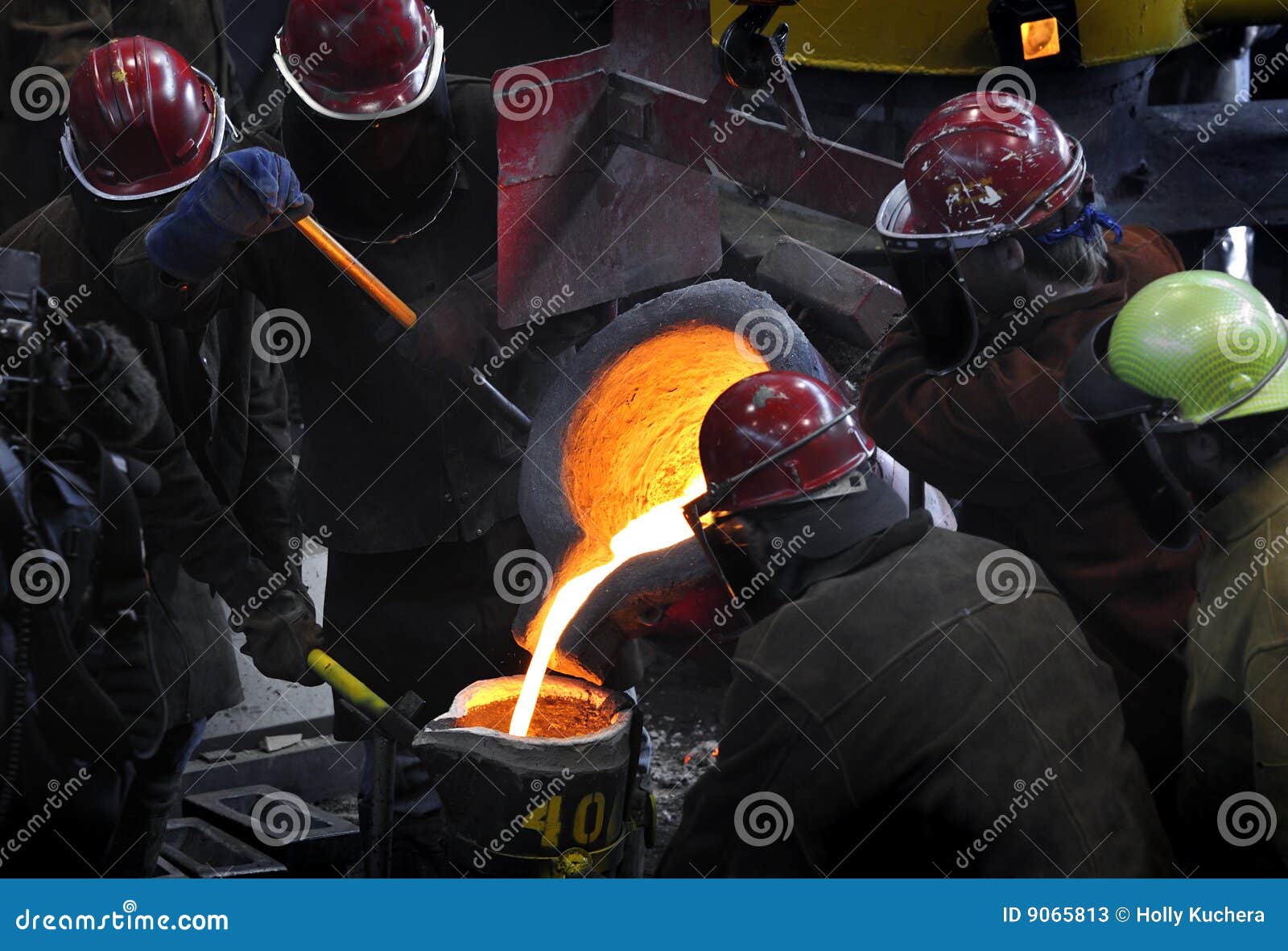 iron pour - workers gather around