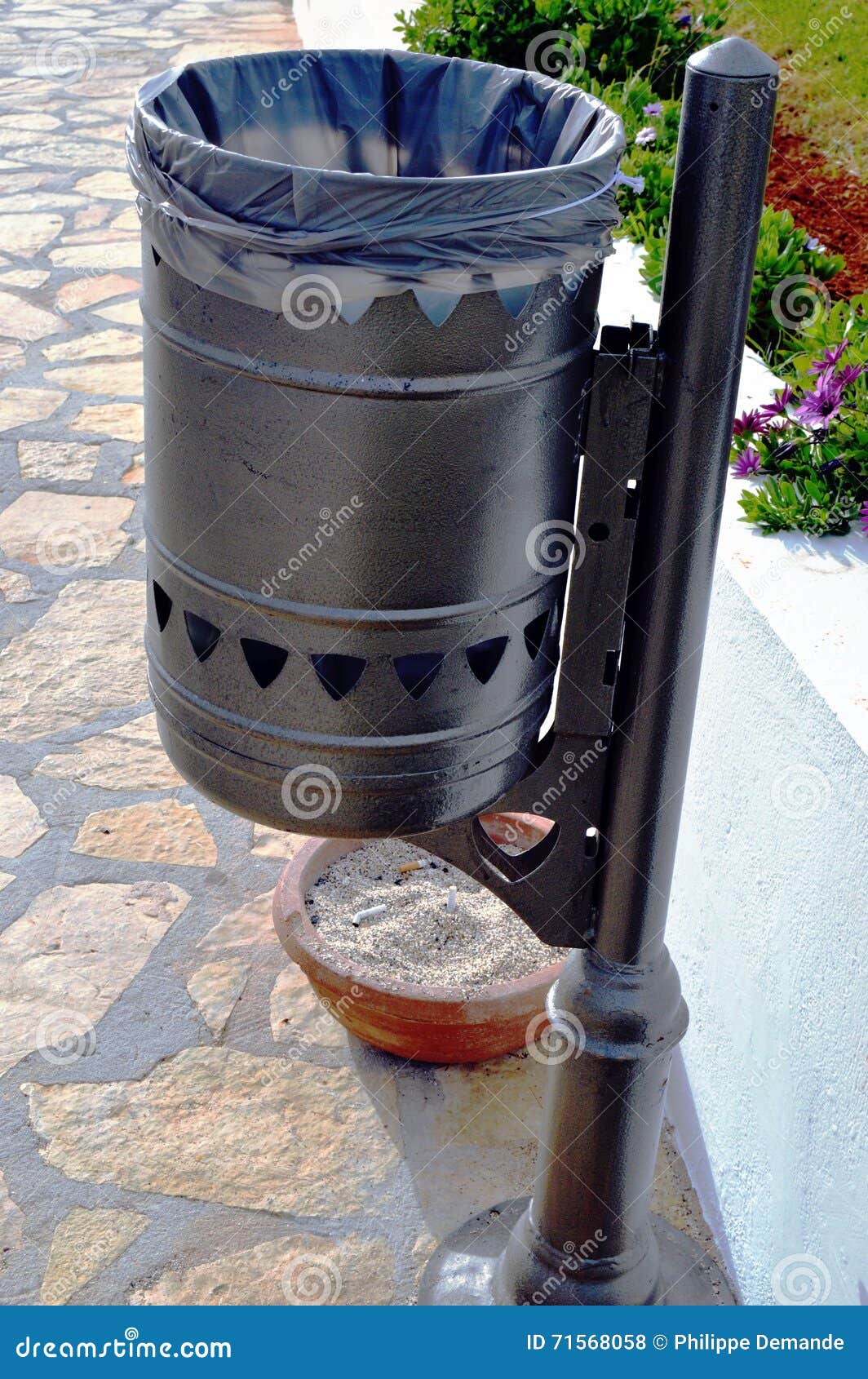 Iron Trash Can of Color Intoxicates on a Foot. Stock Photo Image of