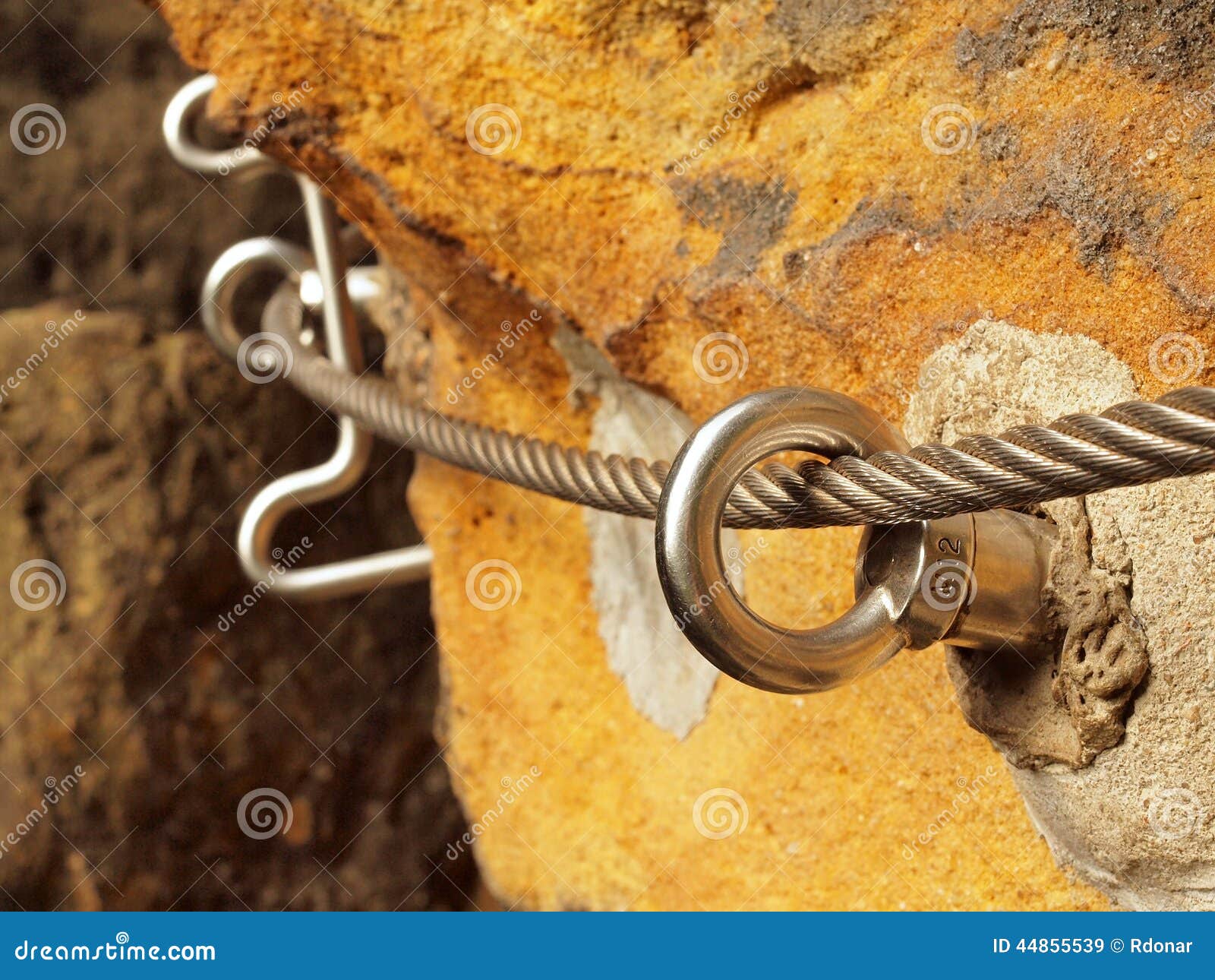 Iron Twisted Rope Fixed in Block by Screws Snap Hooks. Detail of