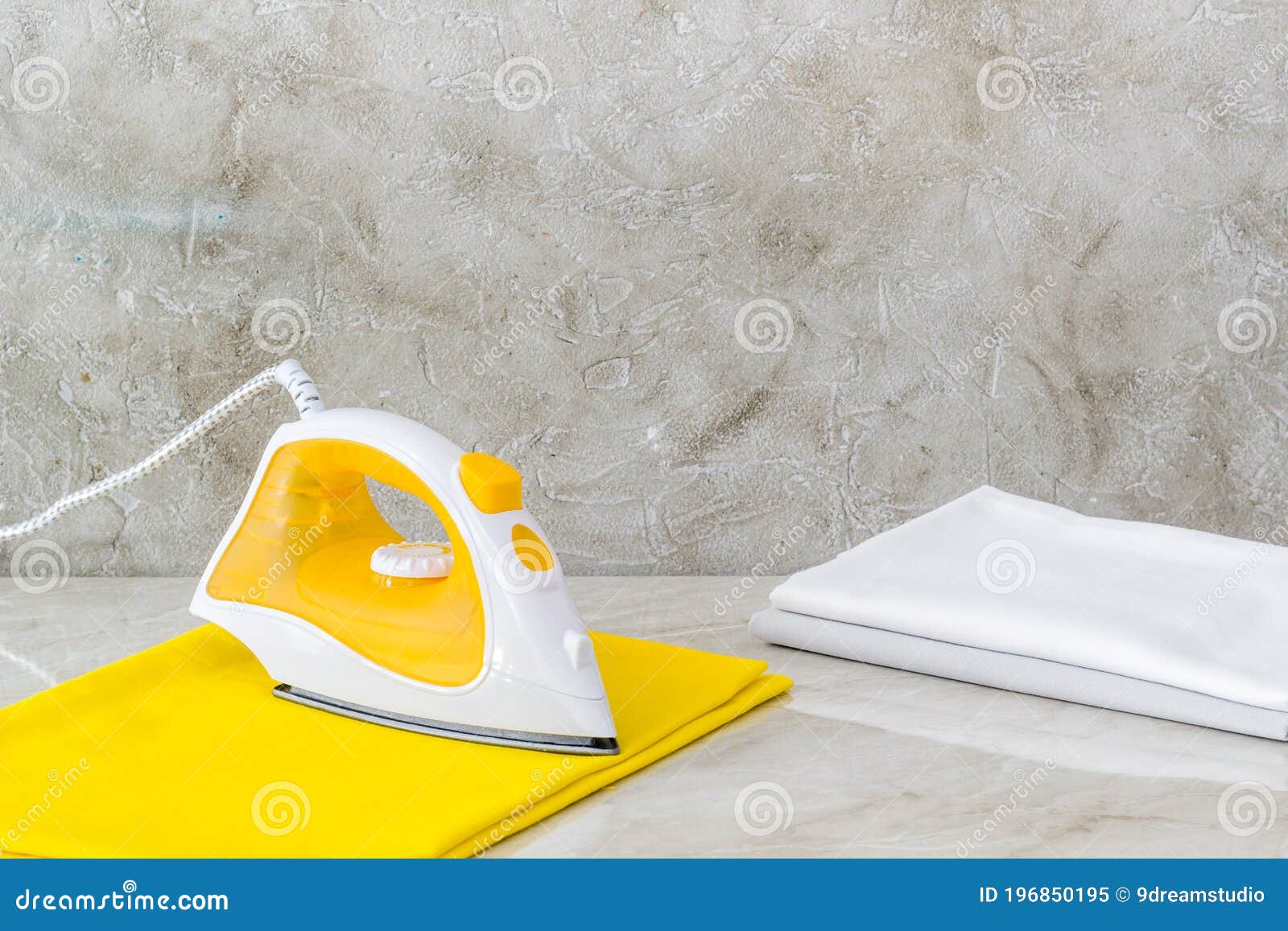 Ironing Clothes with a Yellow Iron on Board Stock Image Image of