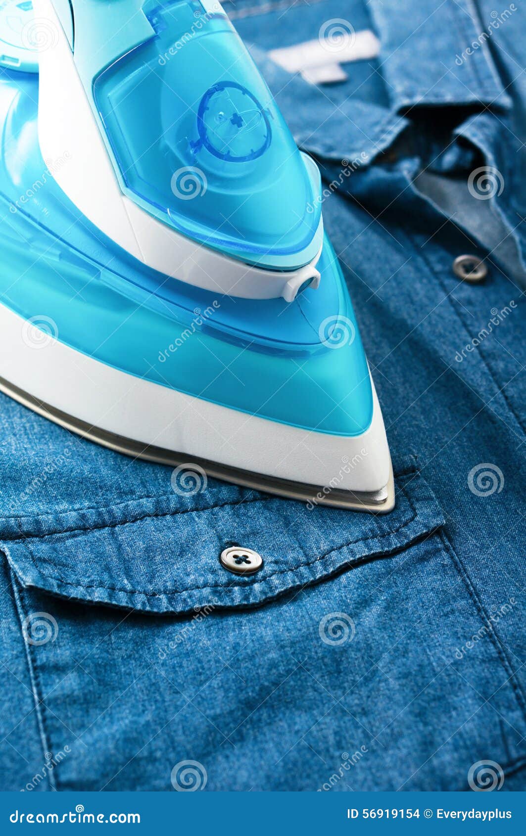 Ironing denim shirt stock photo. Image of clothe, textile 56919154