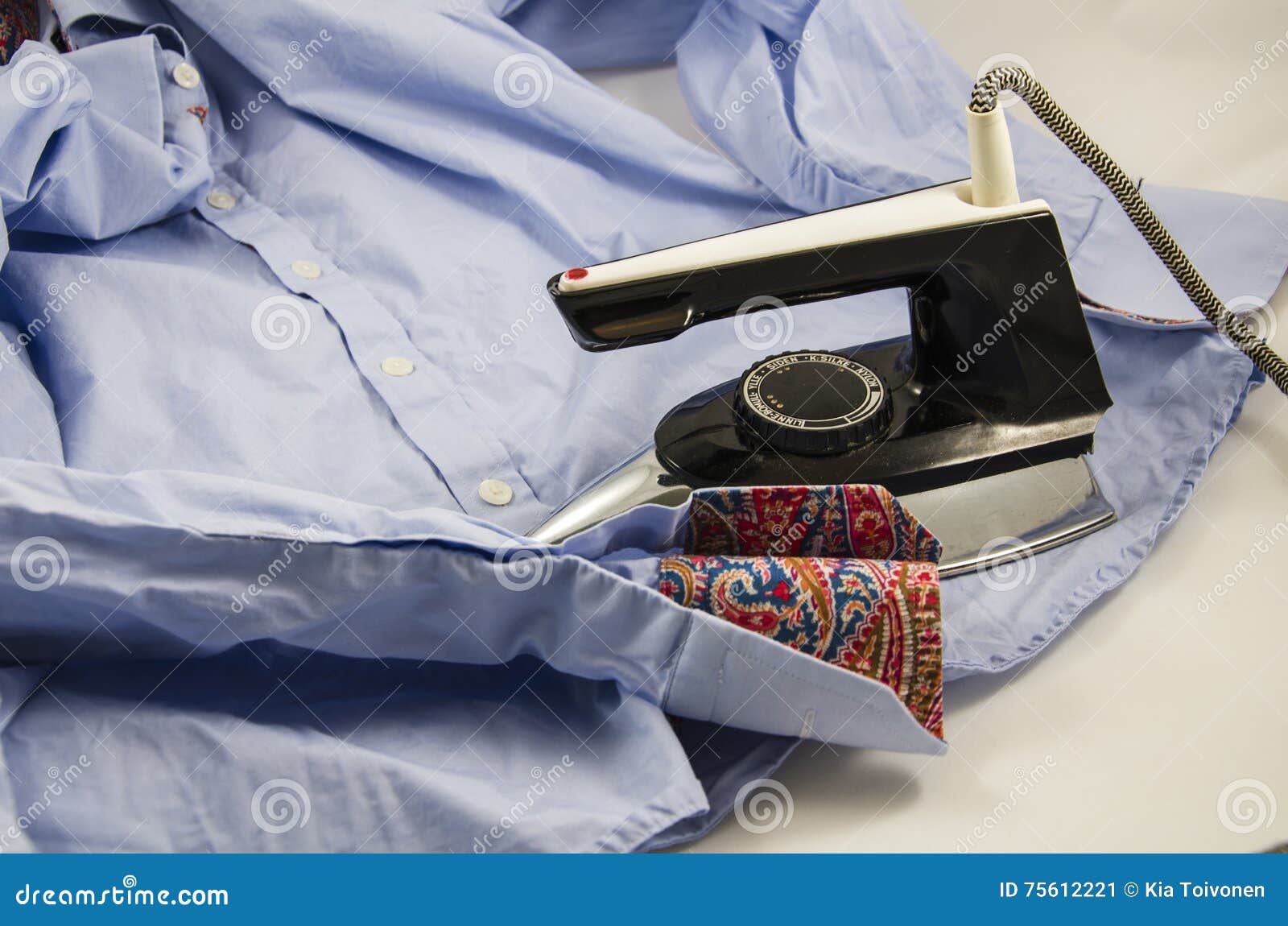 Ironing a shirt stock image. Image of ironing, shirt 75612221