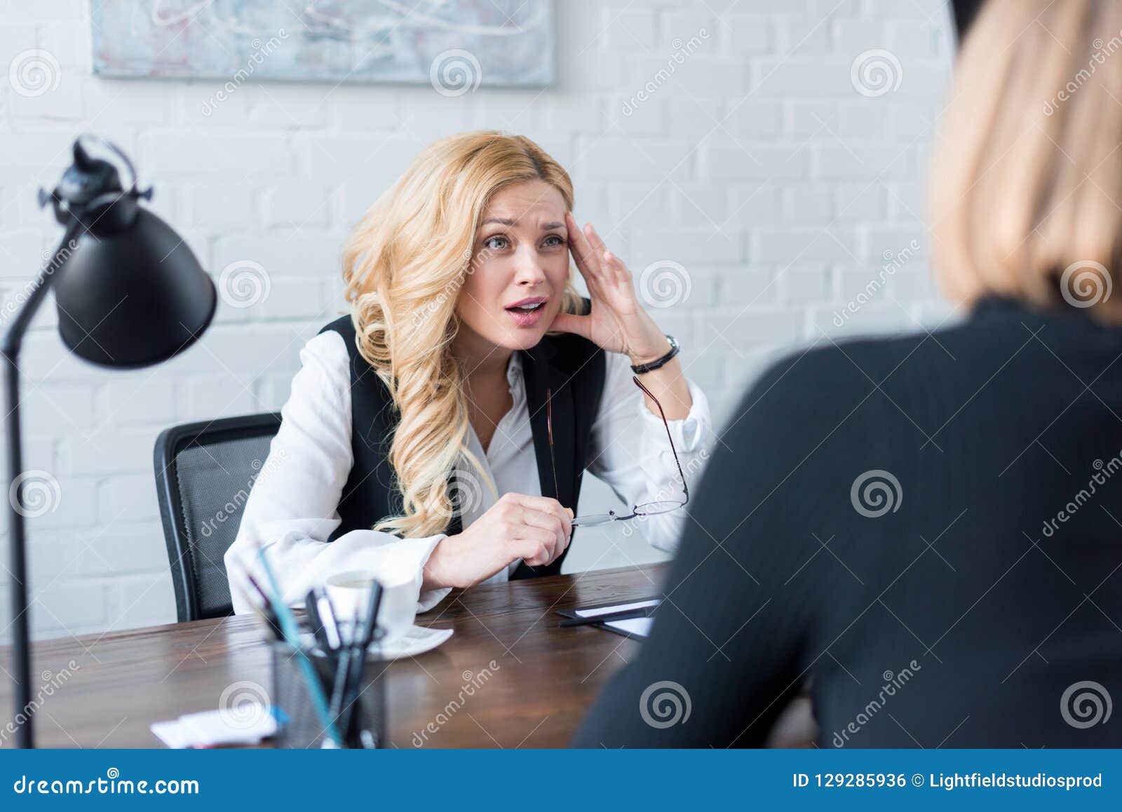 Irritated Businesswoman Looking At Coworker Stock Photo Image Of