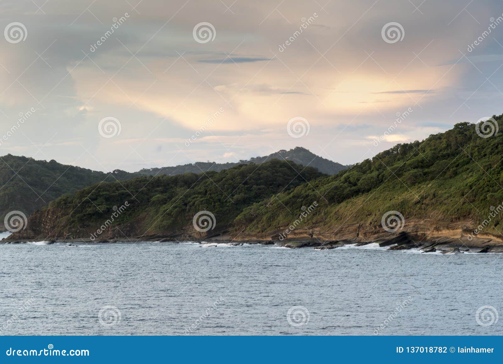 sea, land and sky at sunset off san juan del sur nicaragua from island princess