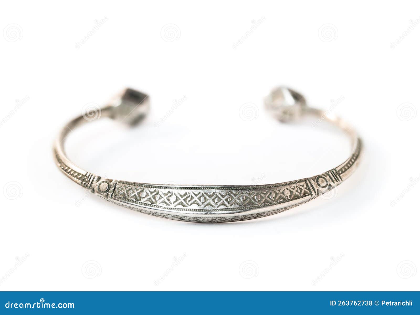 isolated celtic wrist bracelet perspective view old small silver wrist torc engraved pattern viking jewelry female 263762738