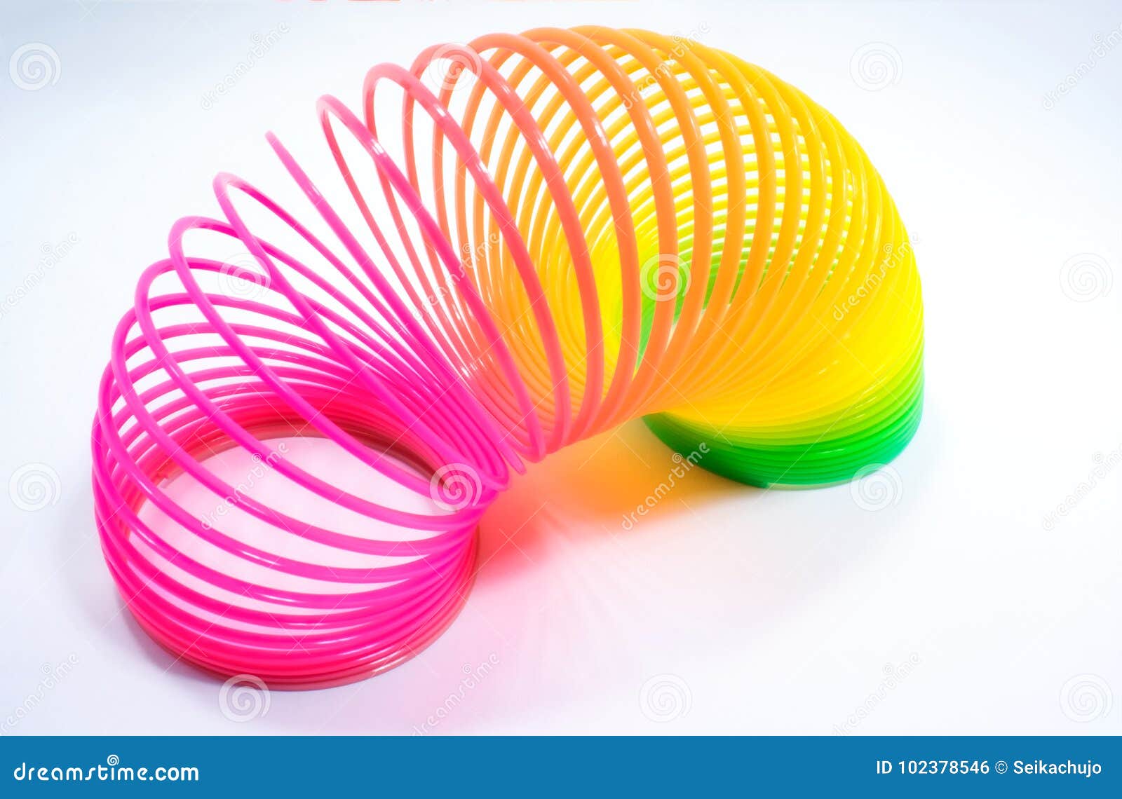 Isolated Colorful and Flexible Bouncy Plastic Spring. Editorial Photo