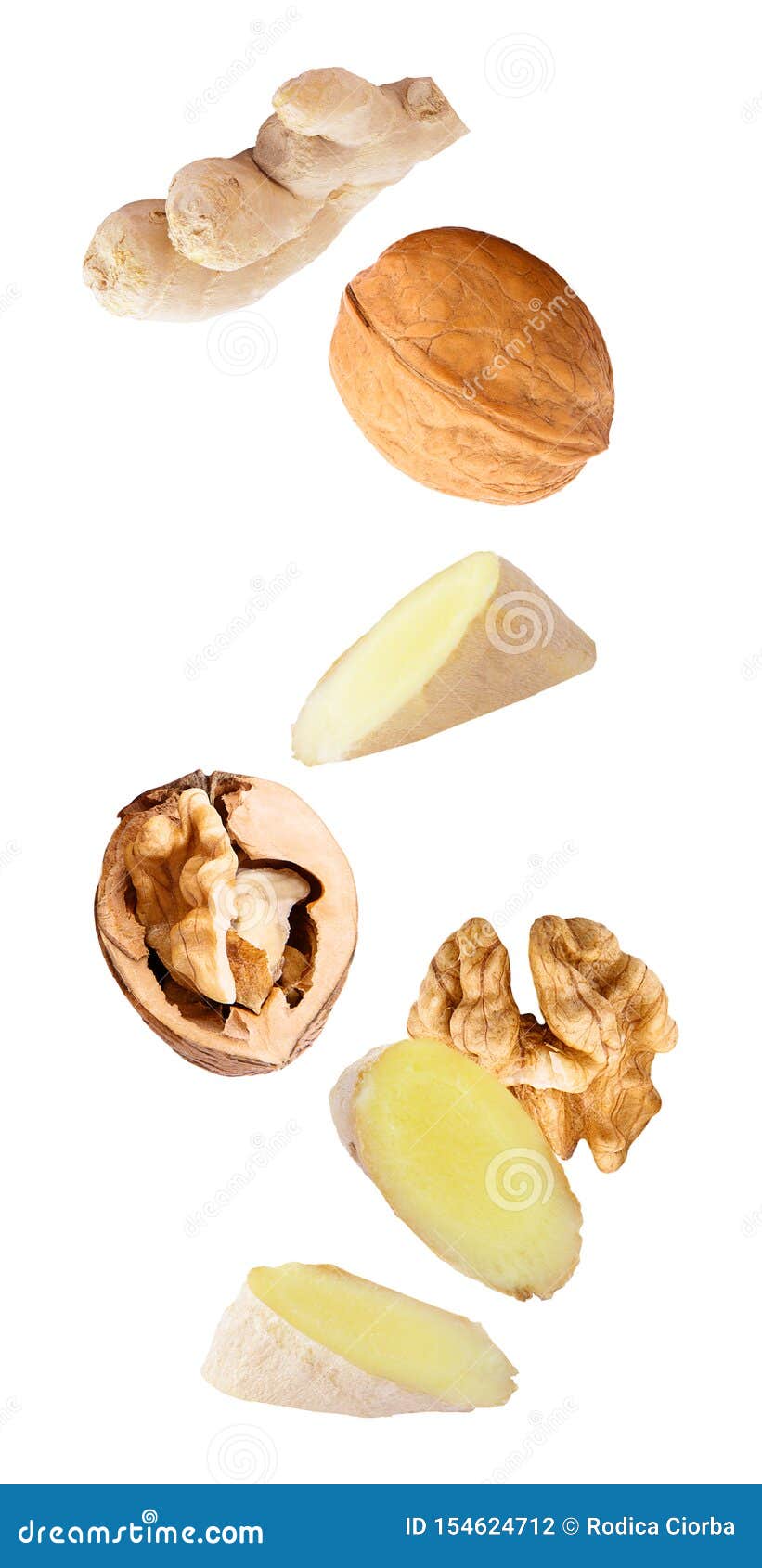 floating walnuts and ginger  on white background