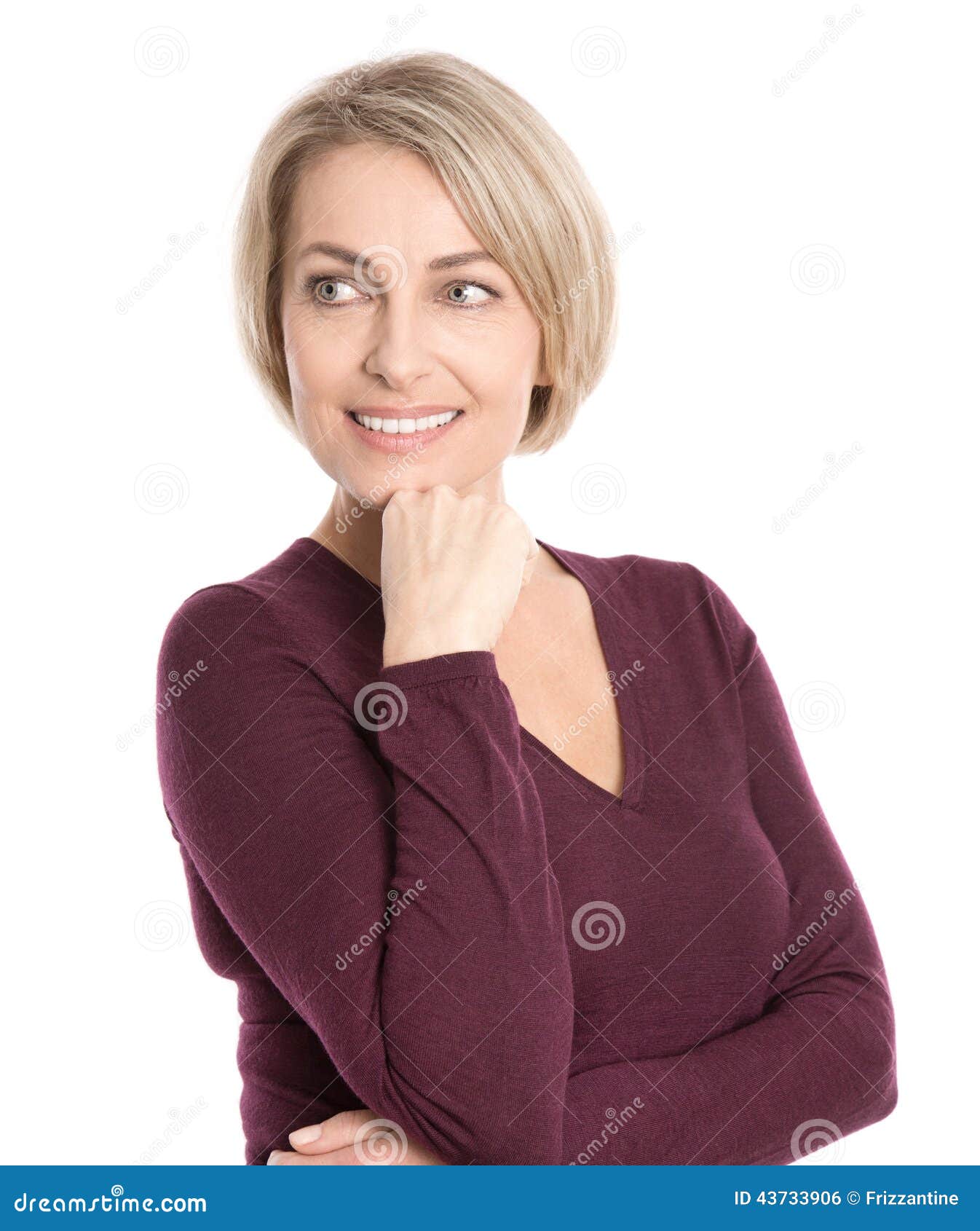  smiling middle aged woman in fall clothes looking sideways.