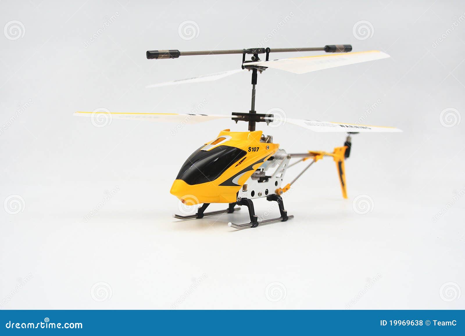 Isolated Yellow Remote Controlled Helicopter Stock Photo Image of isolated, electric 19969638