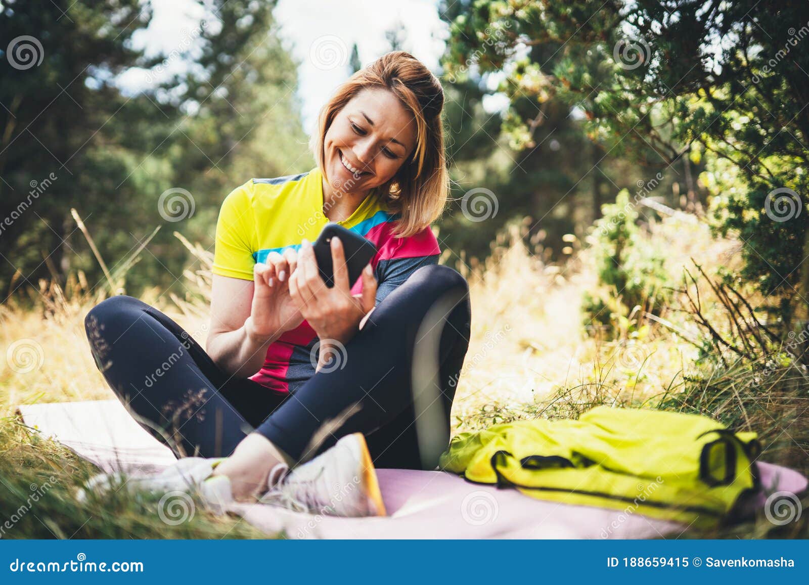 Isolation Girl Laughing Using Smartphone after Training in Park. Smile ...