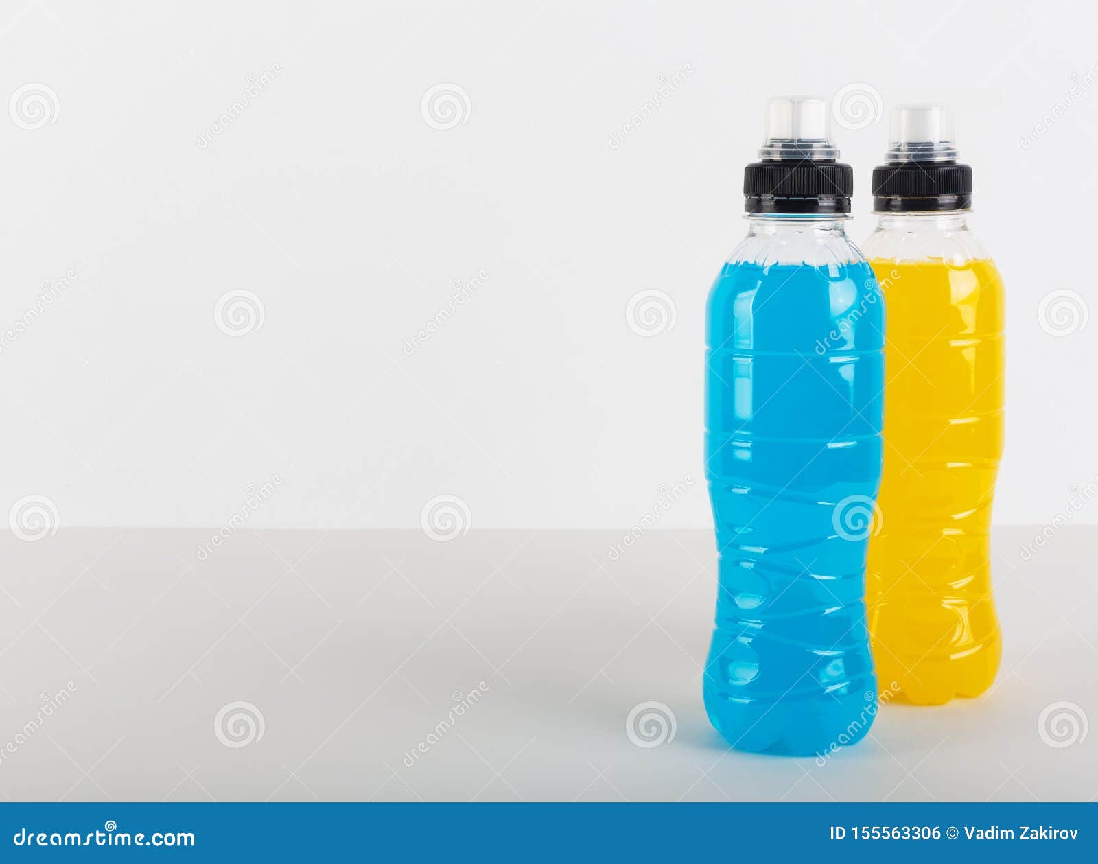 Isotonic Energy Drink Bottles With Blue And Yellow Transparent Liquid Sport Beverage On A White Background Stock Photo Image Of Healthy Energy