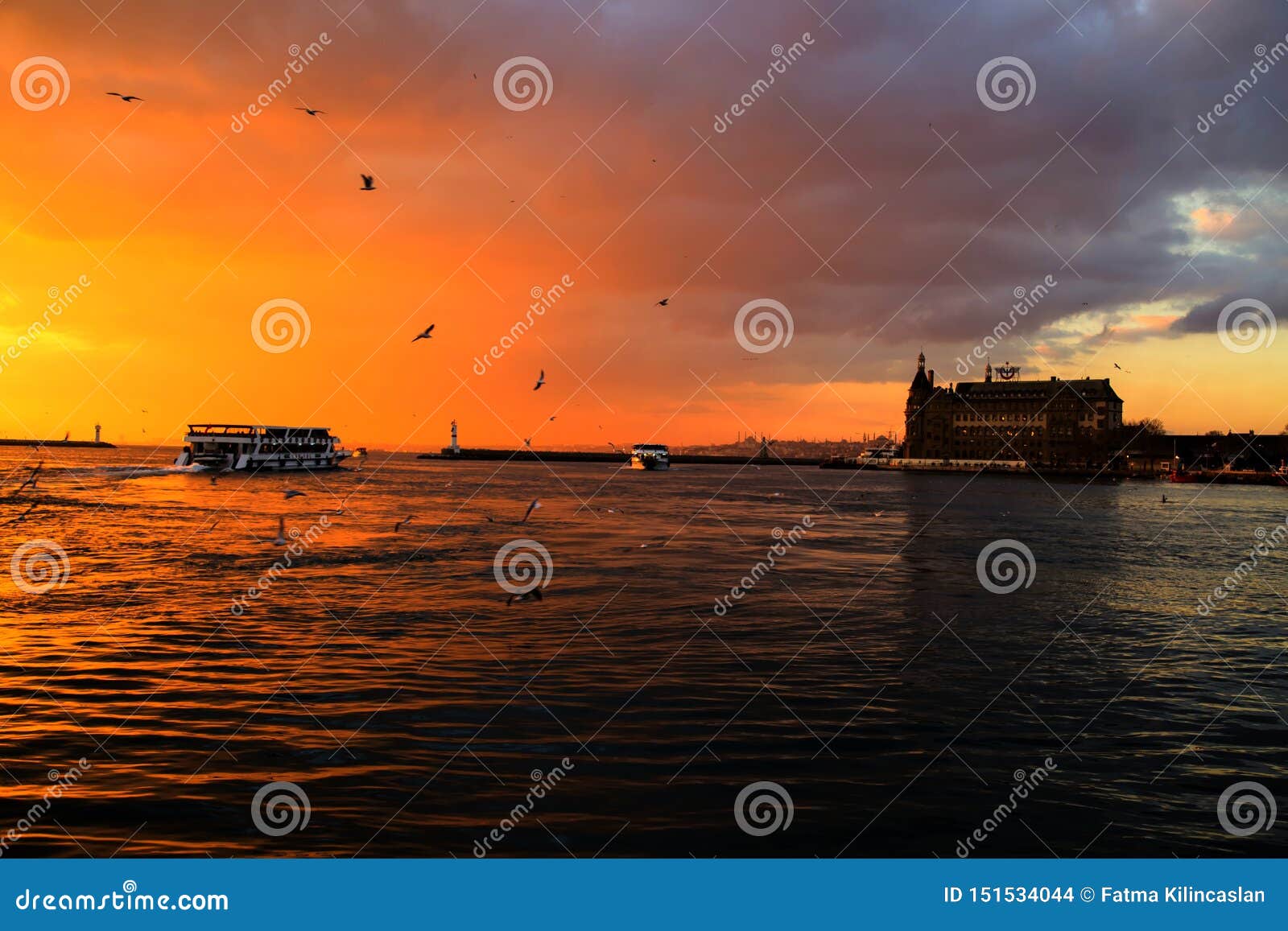 istanbul haydarpasa railway station and view of ferry at sunset