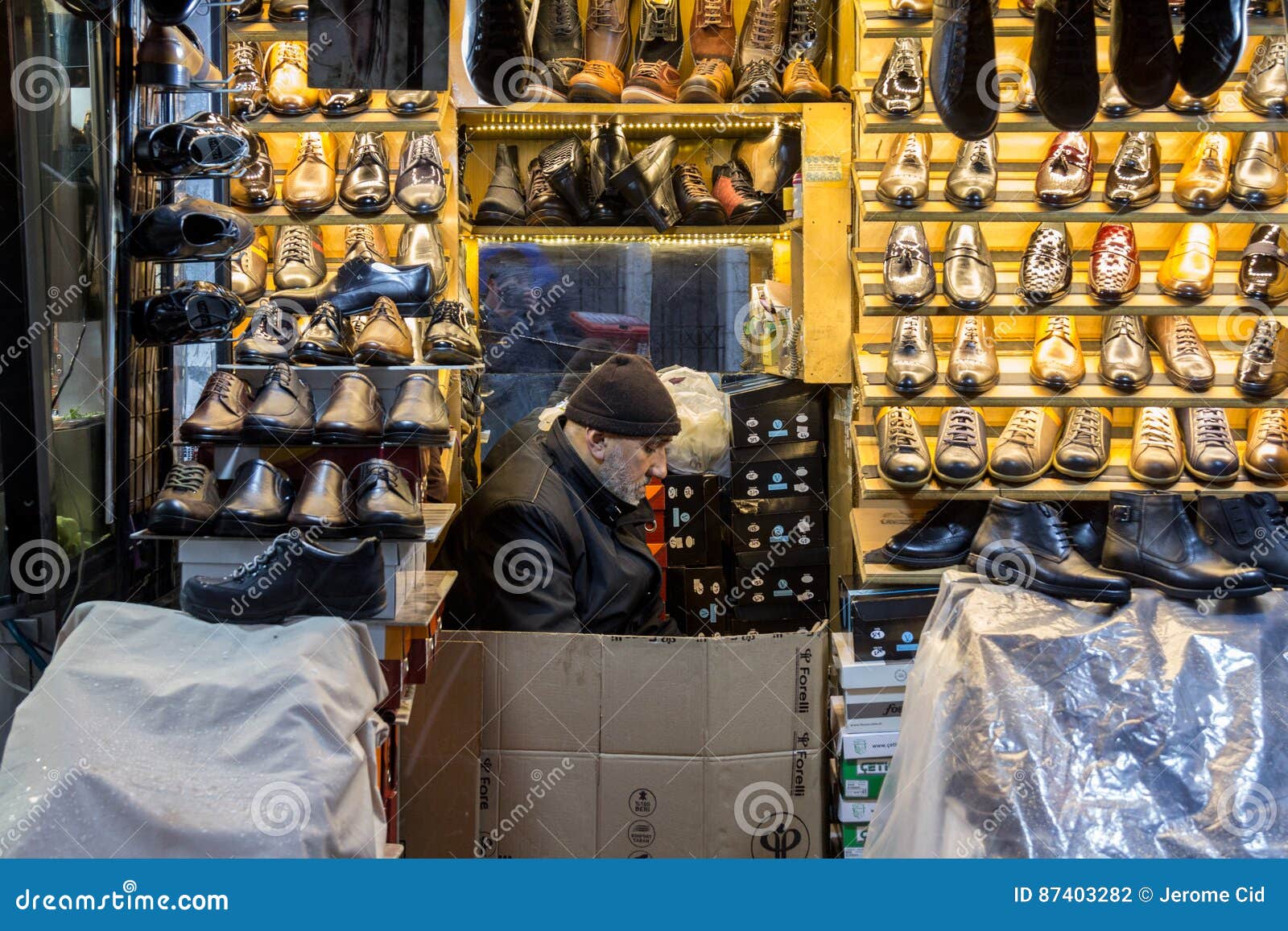 ISTANBUL, TURKEY - DECEMBER 30, 2015: Shoes Seller Near the Spice Bazaar  Resting in His Shop Editorial Photography - Image of seller, resting:  87403282