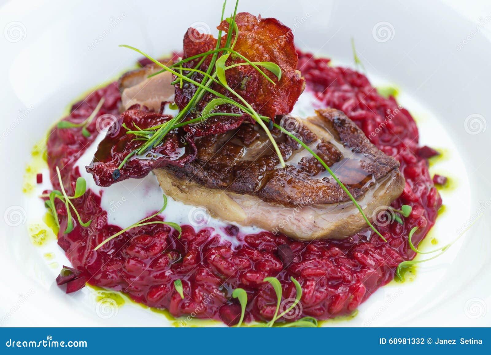 Italian Beetroot Risotto with Delicious Roasted Duck Breast Stock Photo