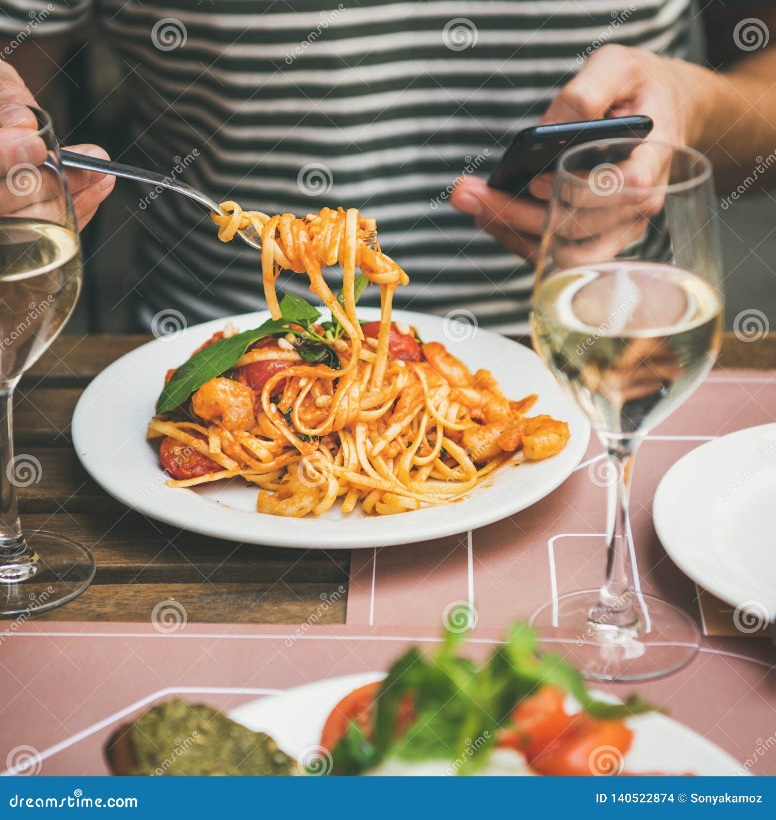 italian dinner at bistrot with caprese salad and pasta