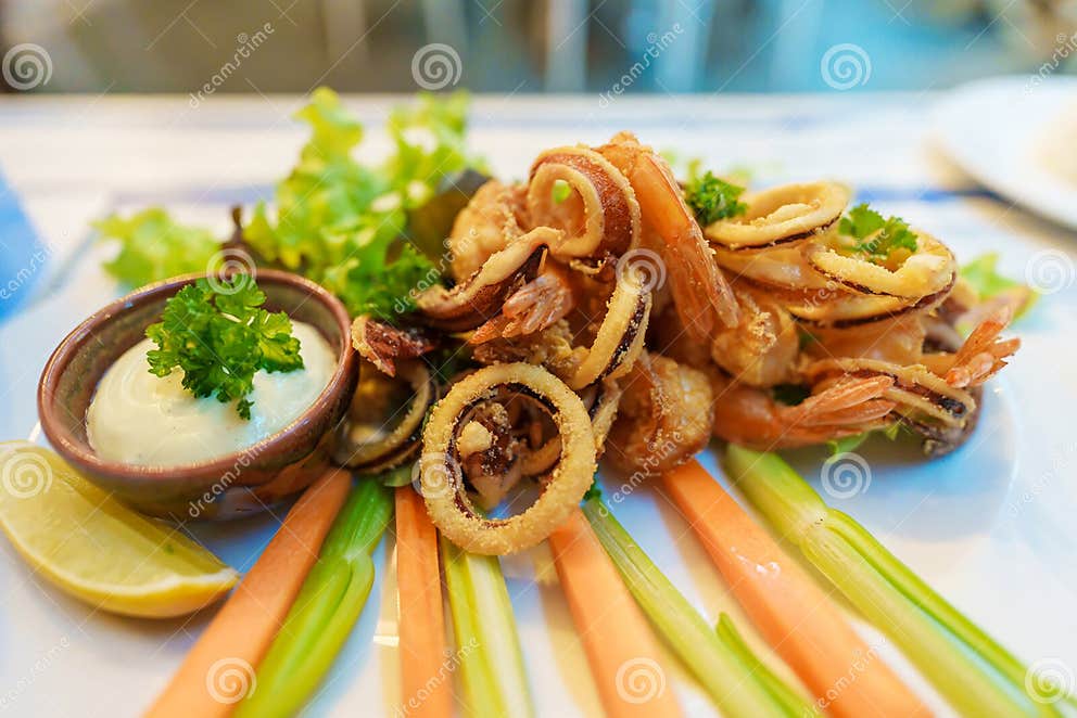 Italian Dish Fried Seafood, Octopus, Shrimp, Squid and Lemon Sliced