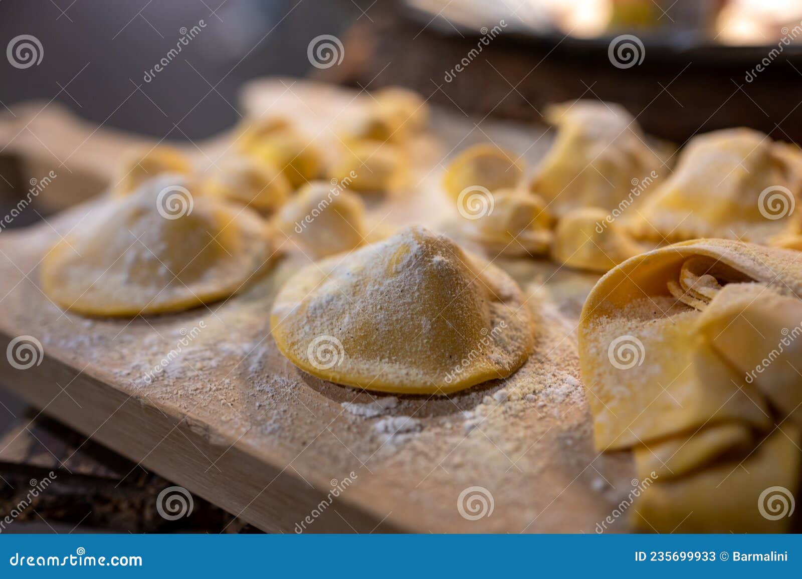 italian food, fresh home made stuffed pasta tortelli or ravioli dumplings ready to cook, parma, emilia romagna, italy