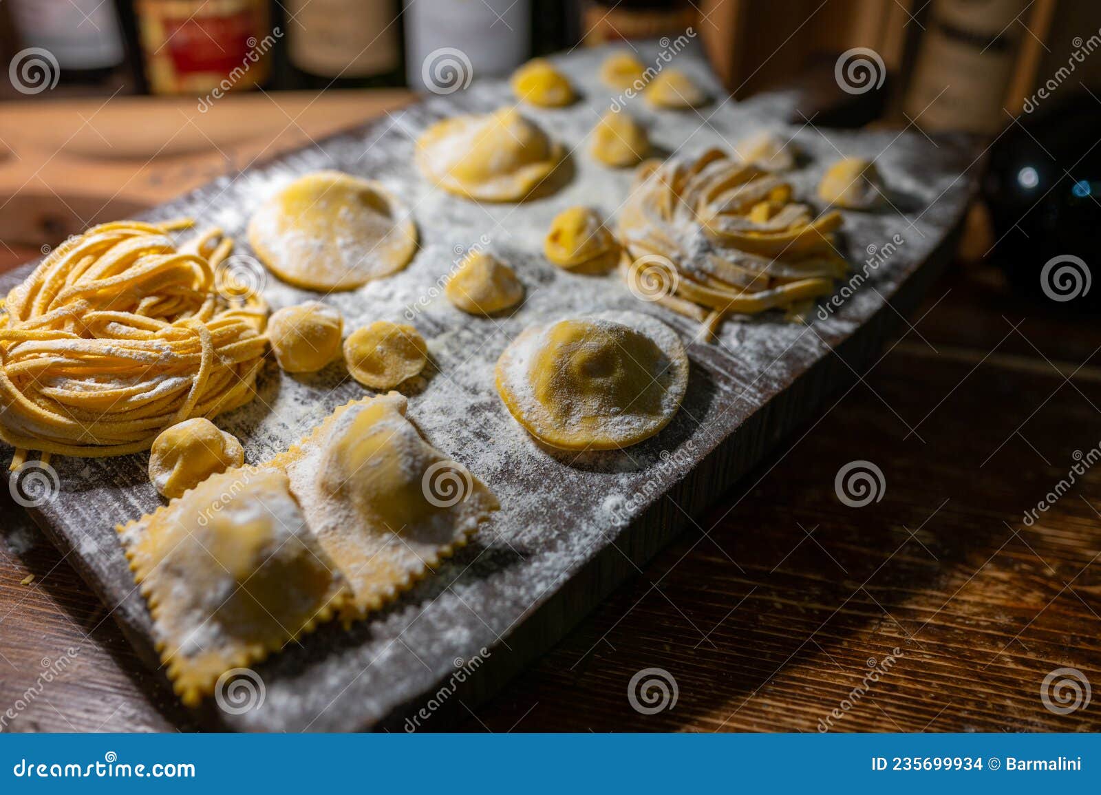 italian food, fresh home made stuffed pasta tortelli or ravioli dumplings ready to cook, parma, emilia romagna, italy