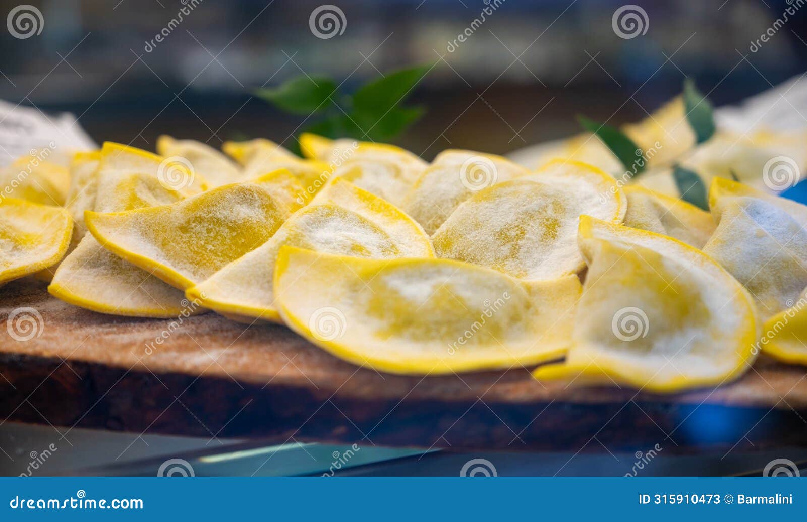 italian food, fresh homemade stuffed pasta tortelli or ravioli dumplings ready to cook, milan, lombardy, italy