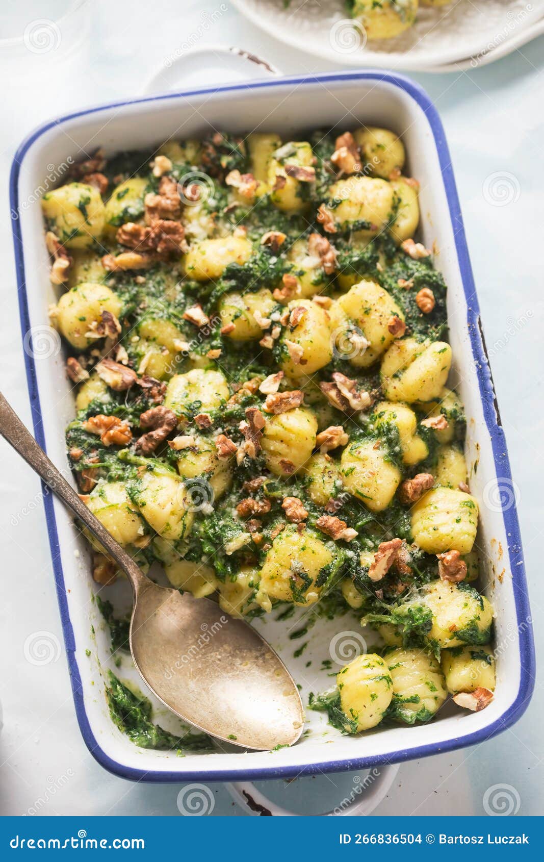 Italian Gnocchi with Cheese, Spinach and Walnuts Stock Photo
