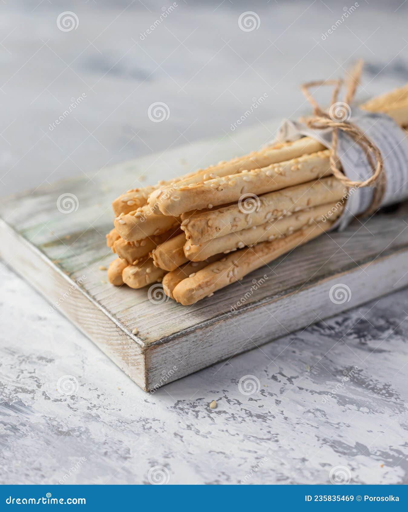 Italian Grissini or Salted Breadsticks on a Light Stone Background. Fresh  Italian Snack with Sesame Seeds Stock Image - Image of grissini, organic:  235835469