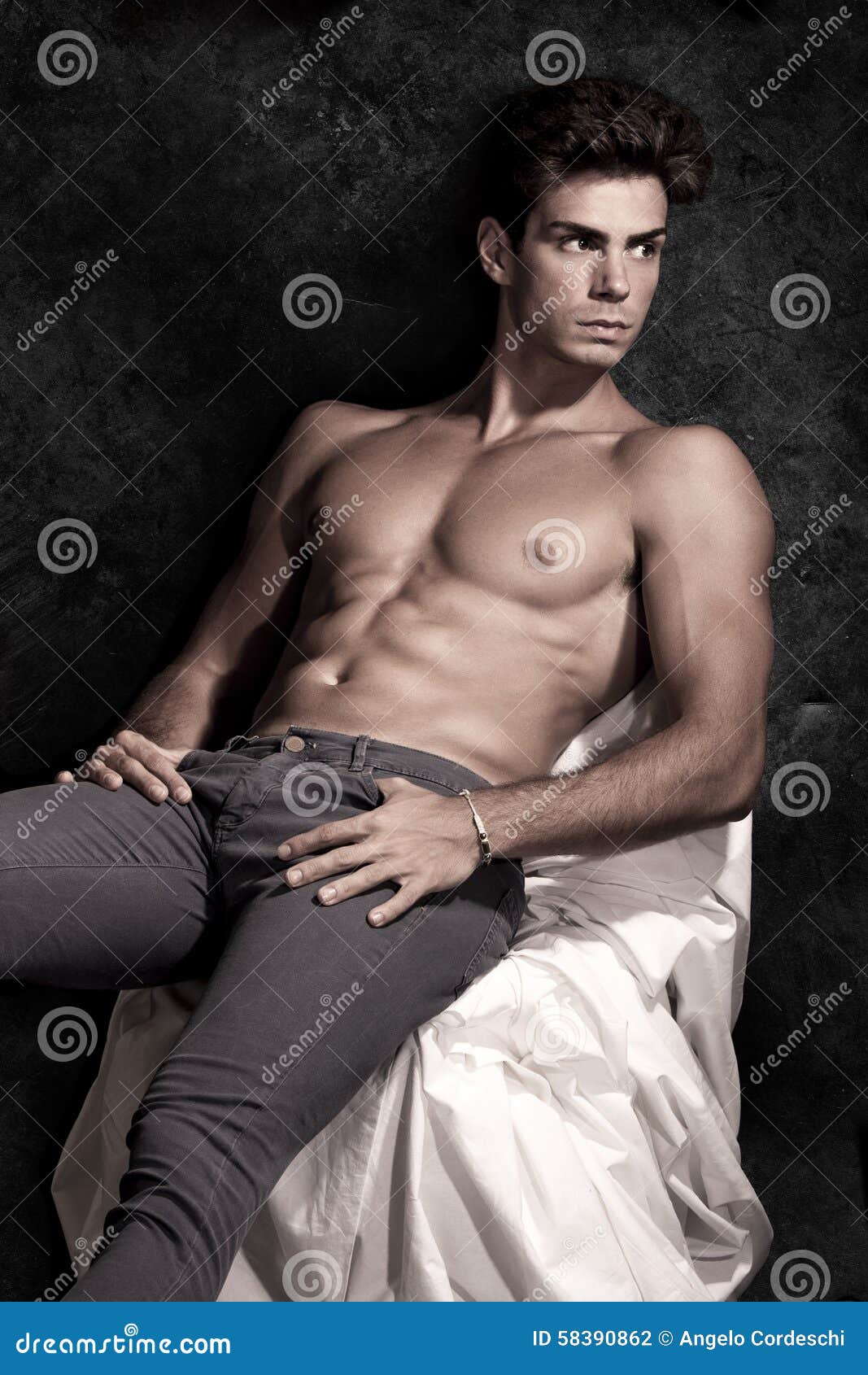 italian model muscular man sitting. shirtless portrait