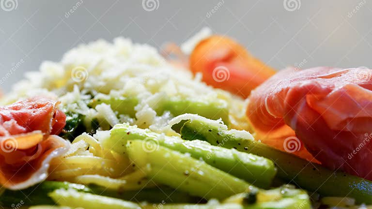 Italian Pasta with Asparagus, Ham and Tomatoes Stock Photo - Image of