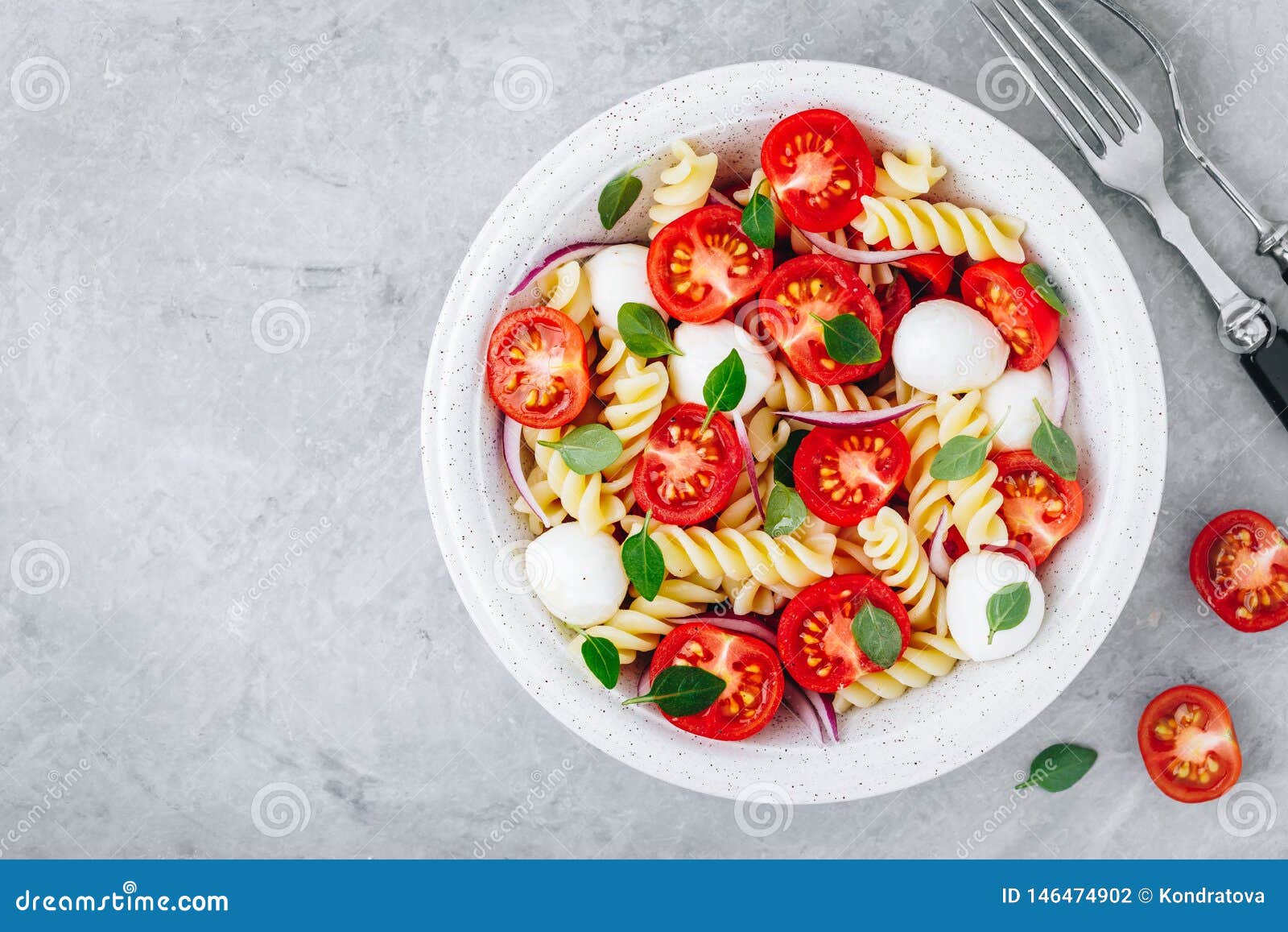 Italian Pasta Salad with Tomatoes, Mozzarella Cheese, Red Onion and