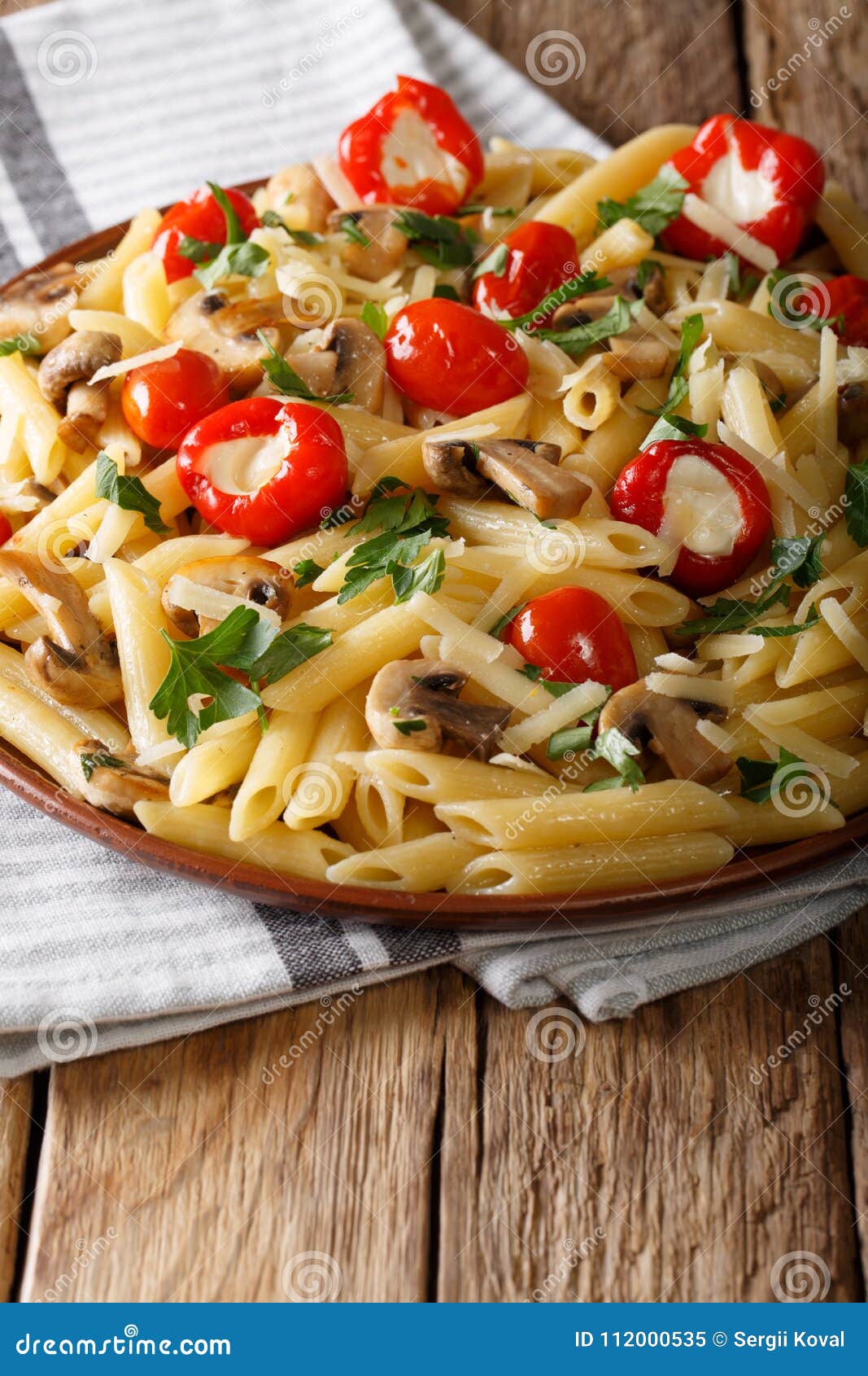 Italian Penne Pasta with Fried Mushrooms, Tomatoes, Pepper and P Stock ...