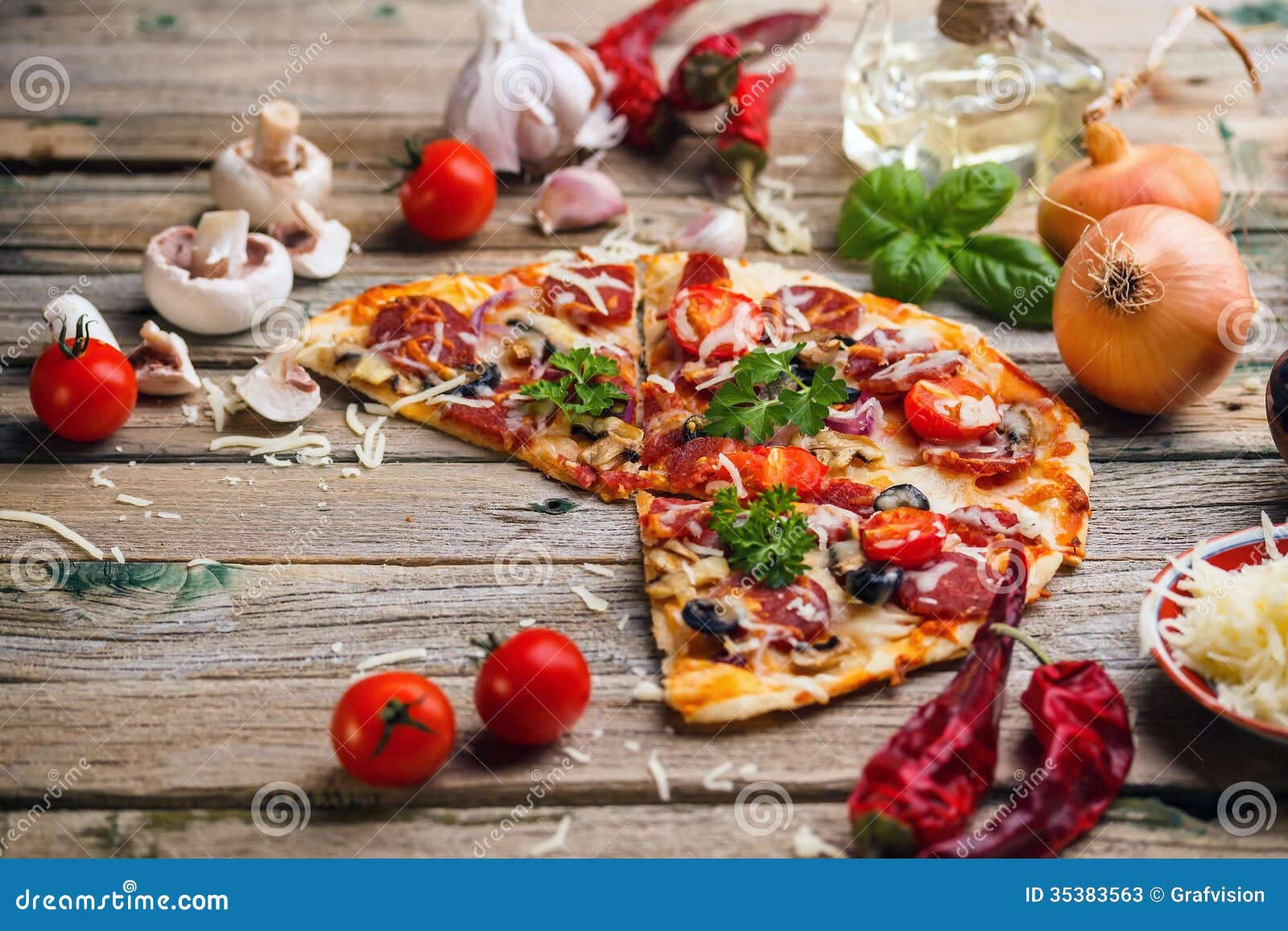 Homemade italian pizza served on wooden table.