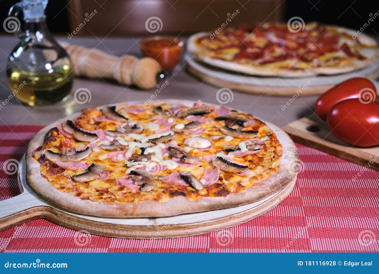 italian pizza tomato sauce with ham and mushrooms