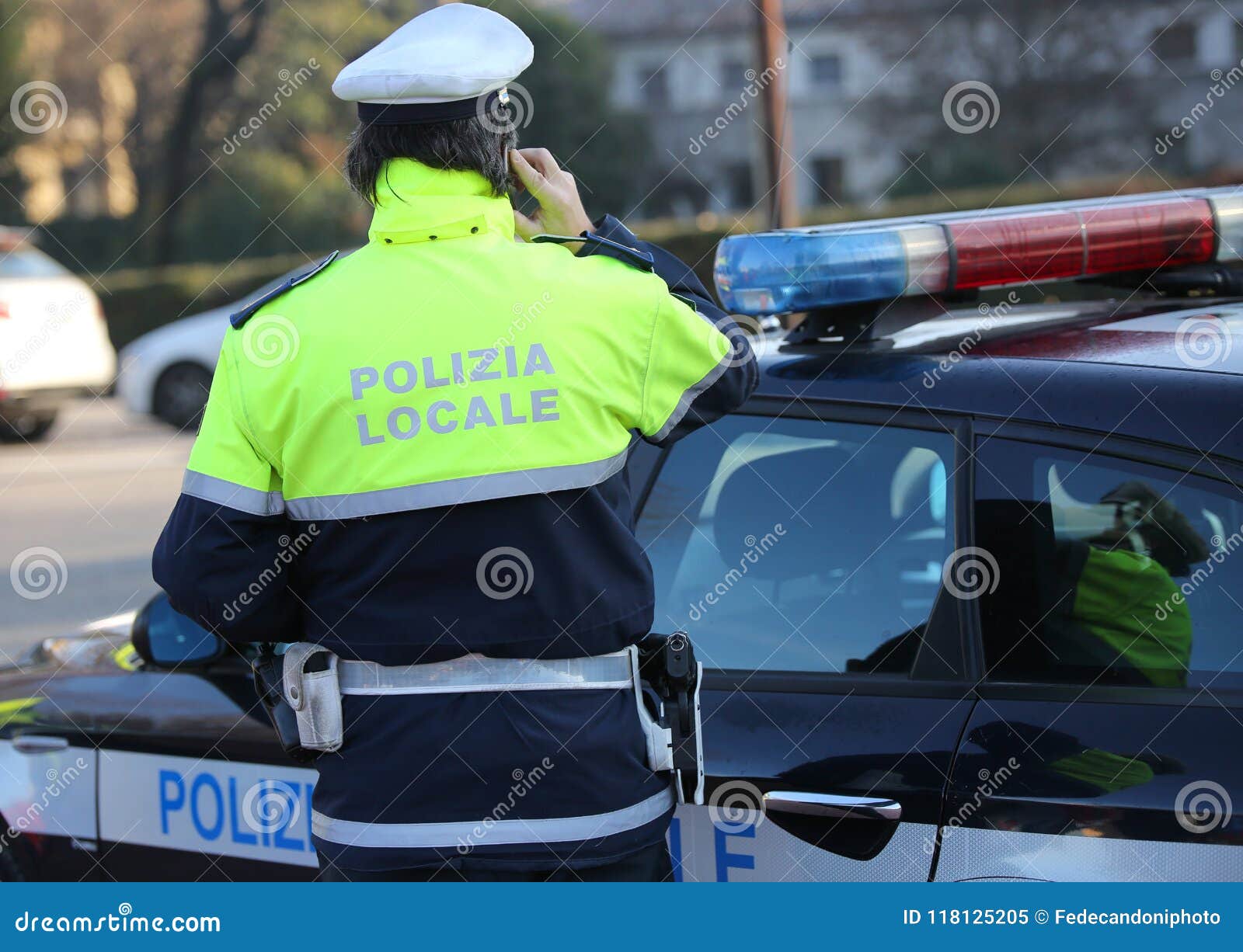 italian police car and policeman with the text polizia locale th