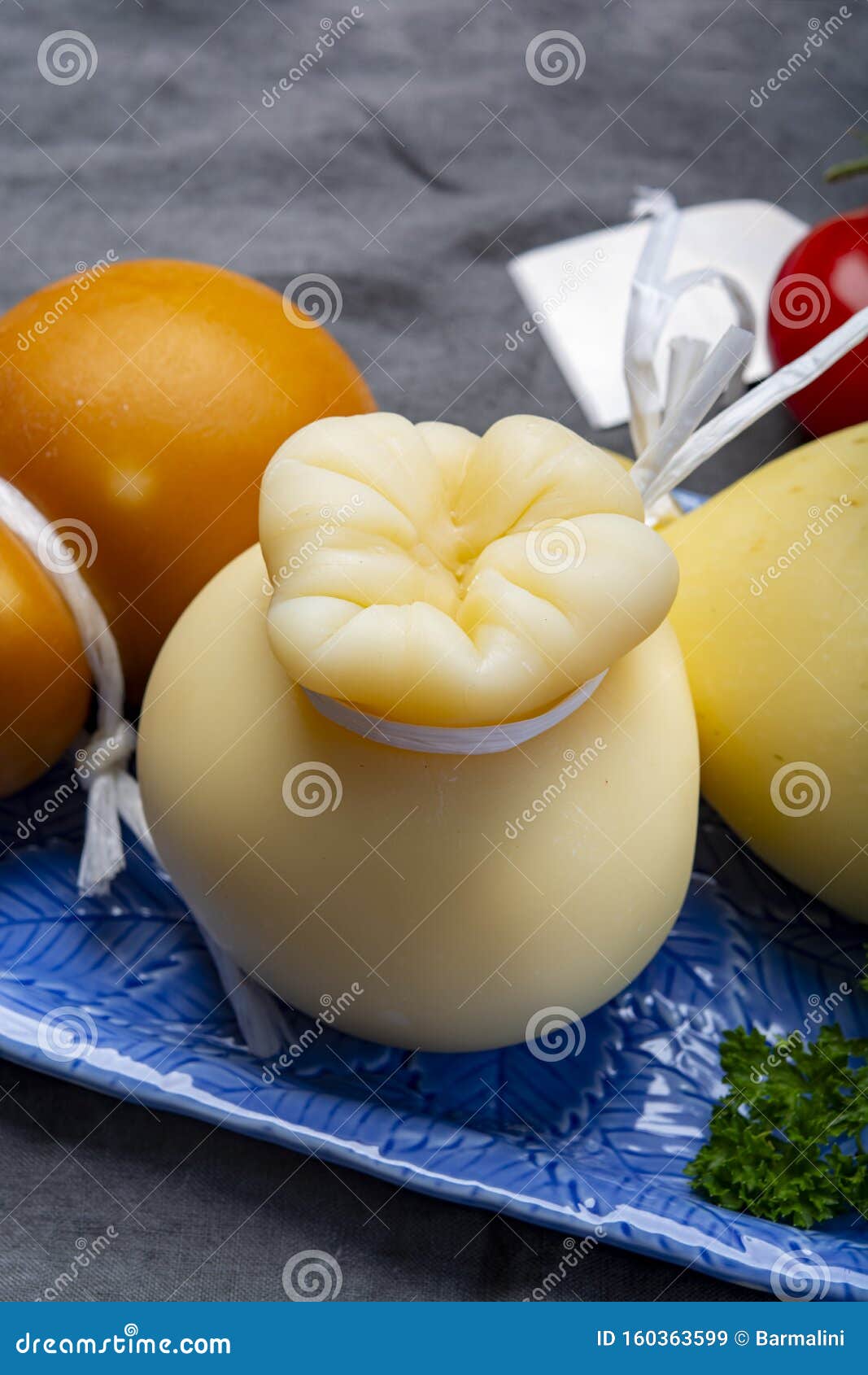 Italian Provolone Caciocavallo Aged and Smoked Cheeses in Teardrop Form  Served on Blue Plate Close Up Stock Image - Image of hard, italy: 160363599