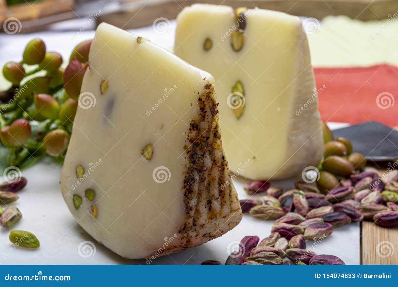 Italian Provolone or Provola Cheese Made in Sicily with Tasty Green Bronte  Pistachio Nuts Served on White Marble Plate Close Up Stock Image - Image of  homemade, rind: 154074833