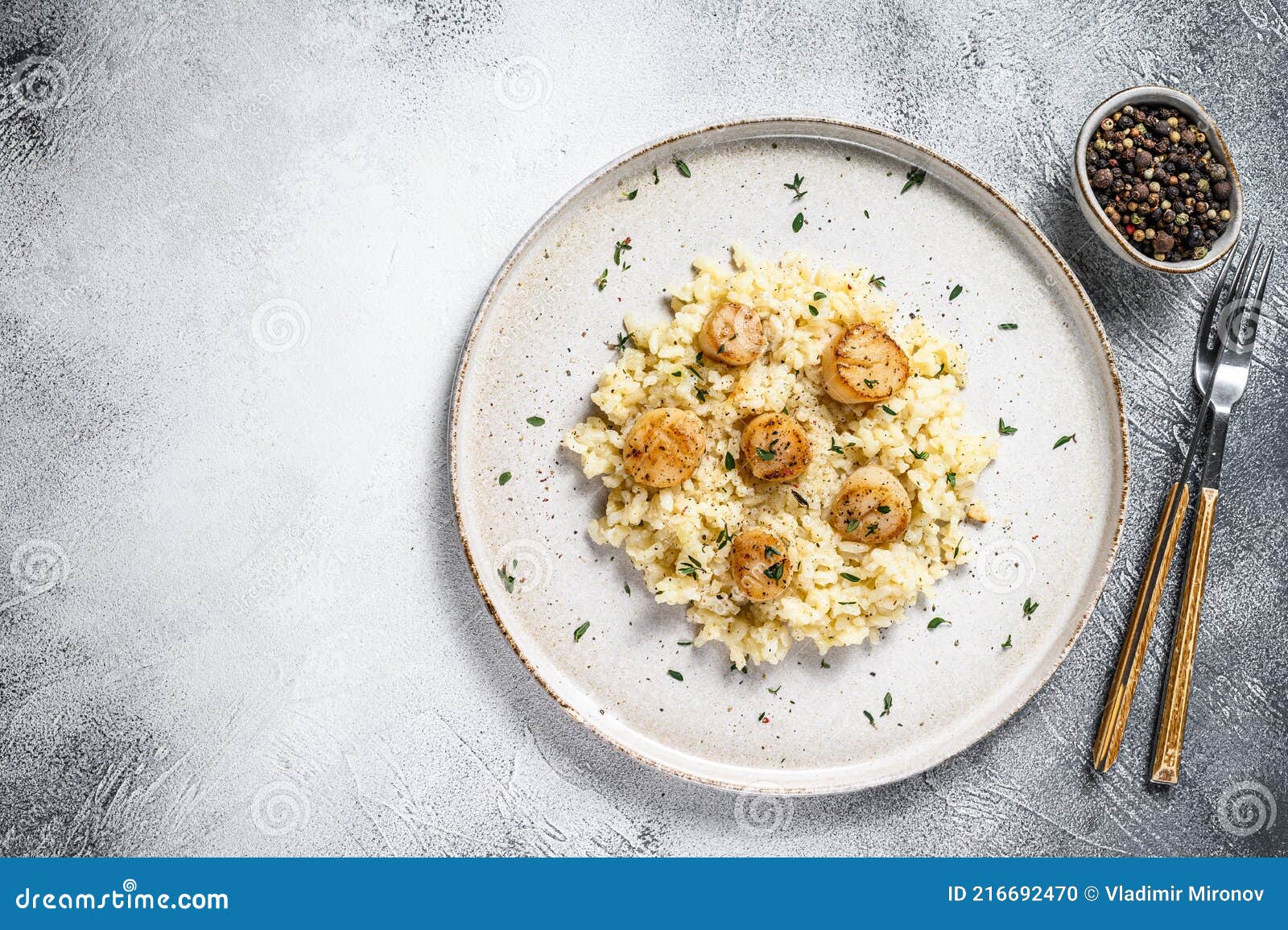 italian risotto with pan seared sea scallops. white background. top view. copy space