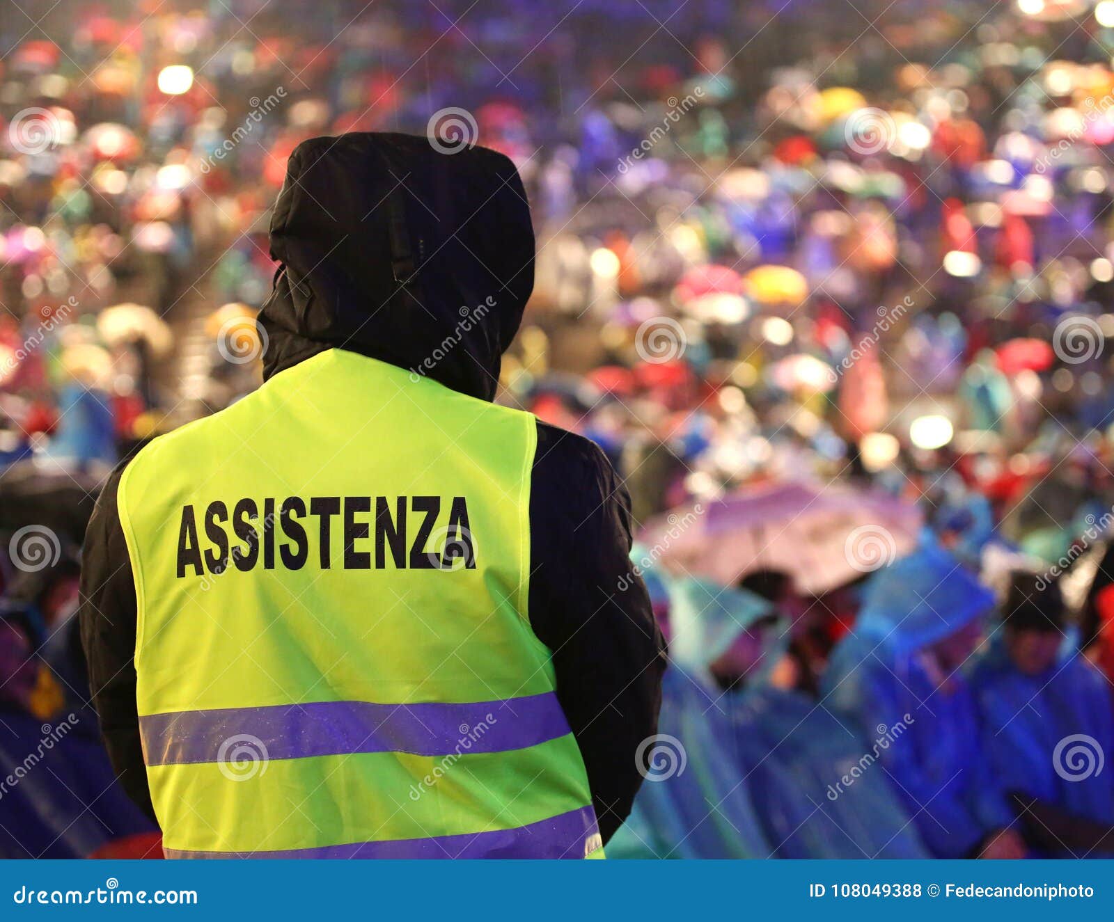 italian security guard during the event with text assistenza that means assitance in italian language