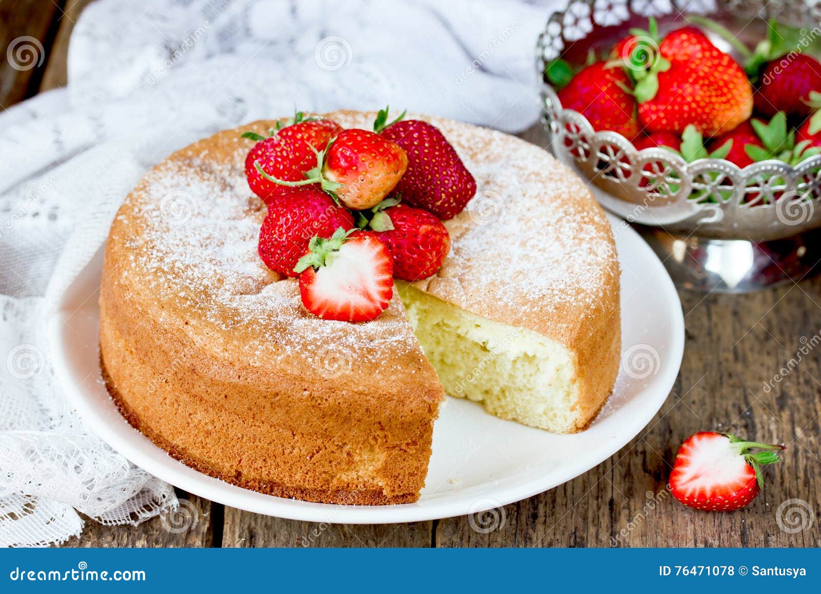 italian sponge cake pan di spagna with strawberry on old wooden