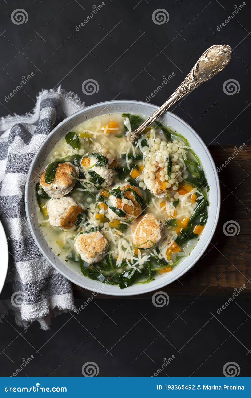 Italian Wedding Soup with Meatballs and Ptitim Paste Stock Photo