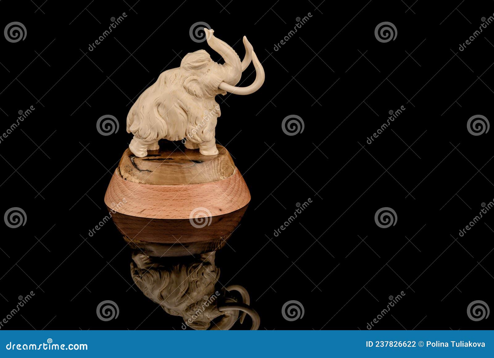 Ivory Statuette of Elephant Mammoth on Black Background Stock Photo ...