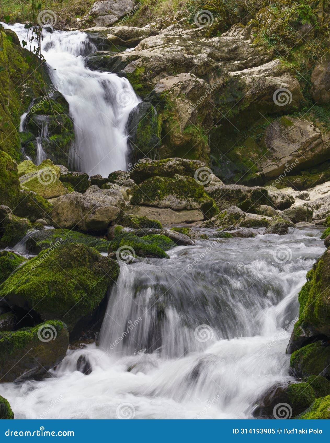 ixkier ur-jauzia. ixkier waterfall on the plazaola greenway, mugiro, navarra