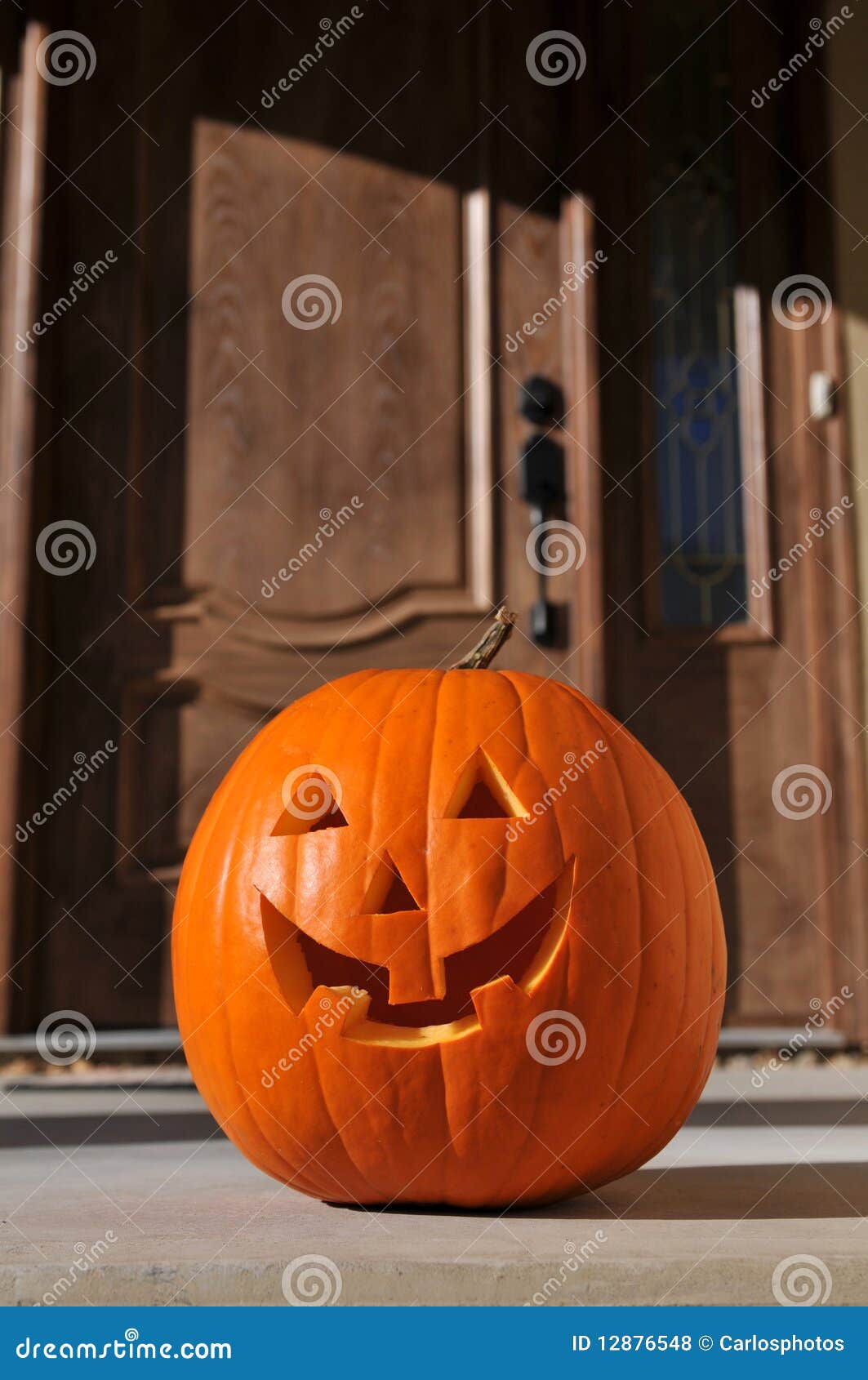 Jack olantern by the door stock photo. Image of carving 12876548