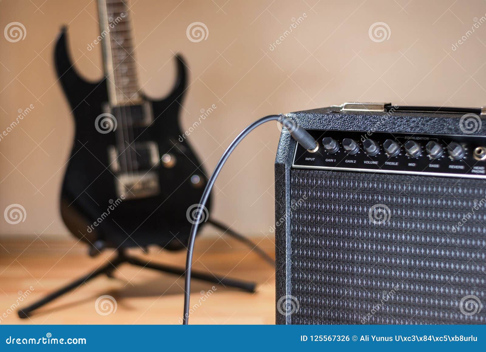 Plugged guitar and amp stock photo. Image of close, sound 125567326
