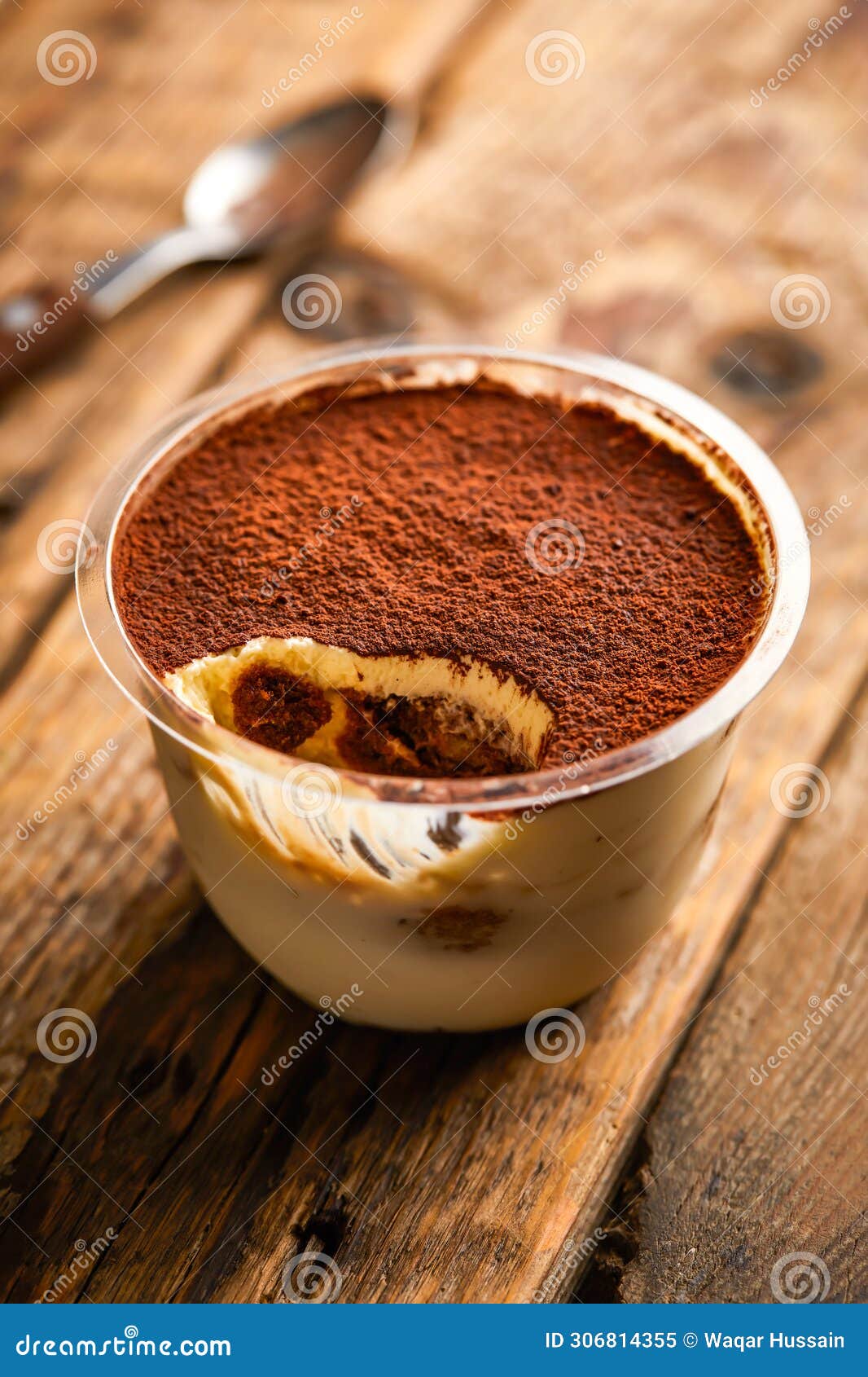 jacopo tiramisu mousse served in jar  on wooden table top view of arabic sweet dessert