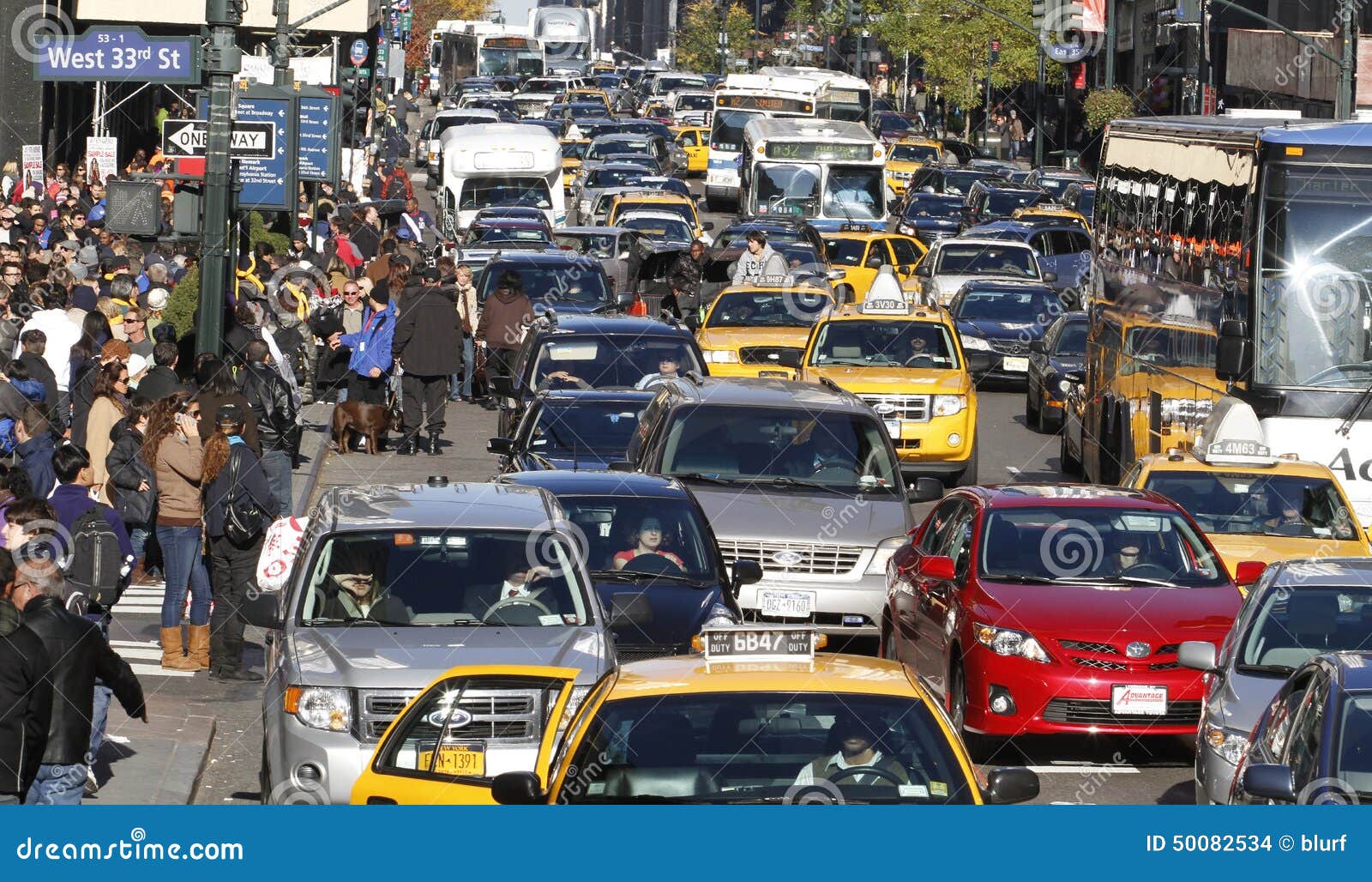 Yellow Taxis And Busy Traffic In Manhattan Stock Photo - Download