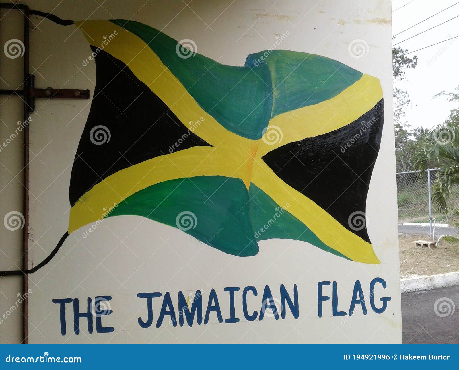Jamaican Flag On Old White Wall Banner Stock Photography